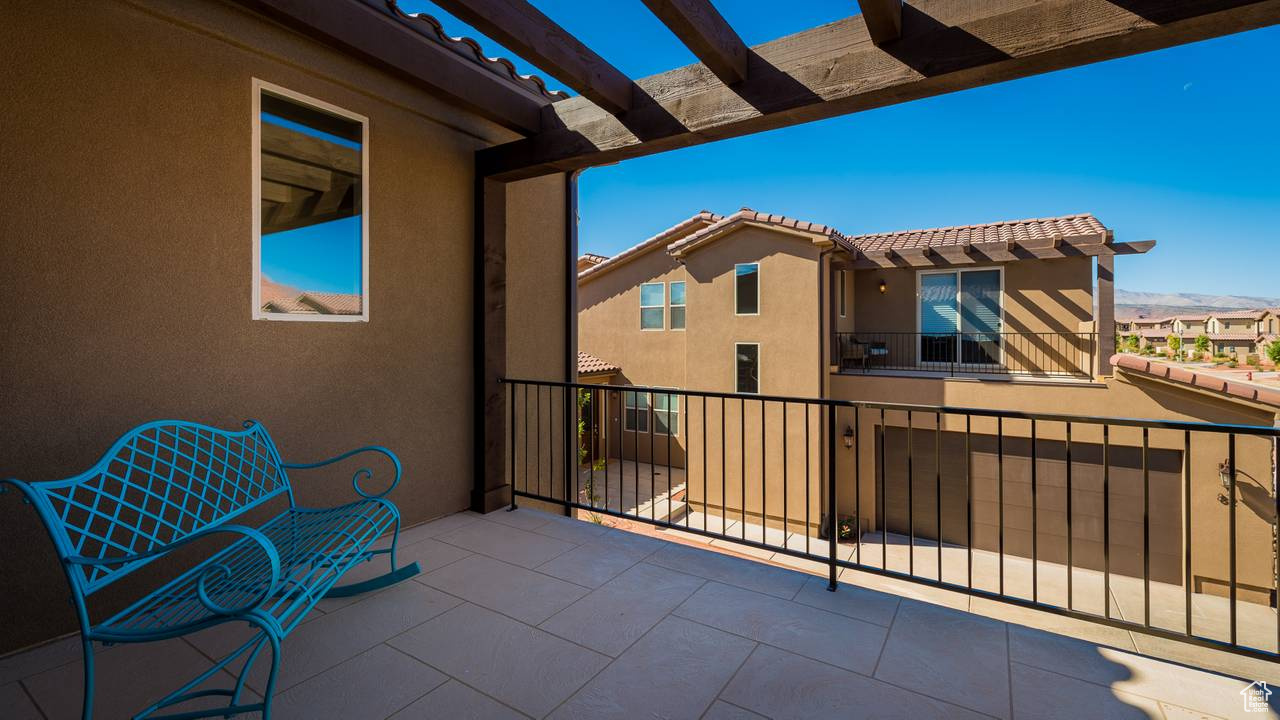 Balcony featuring a patio and a pergola