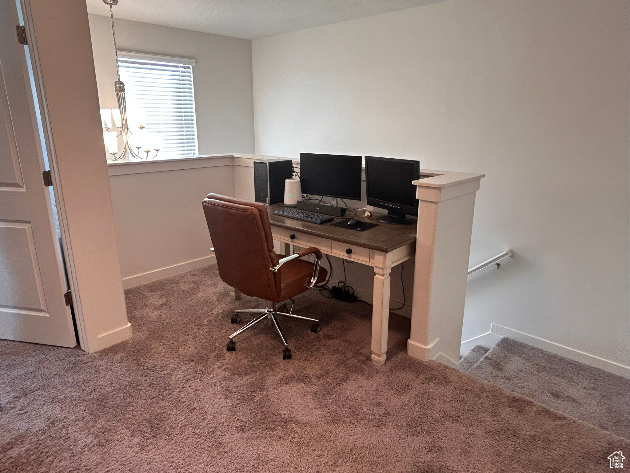 Home office featuring carpet flooring