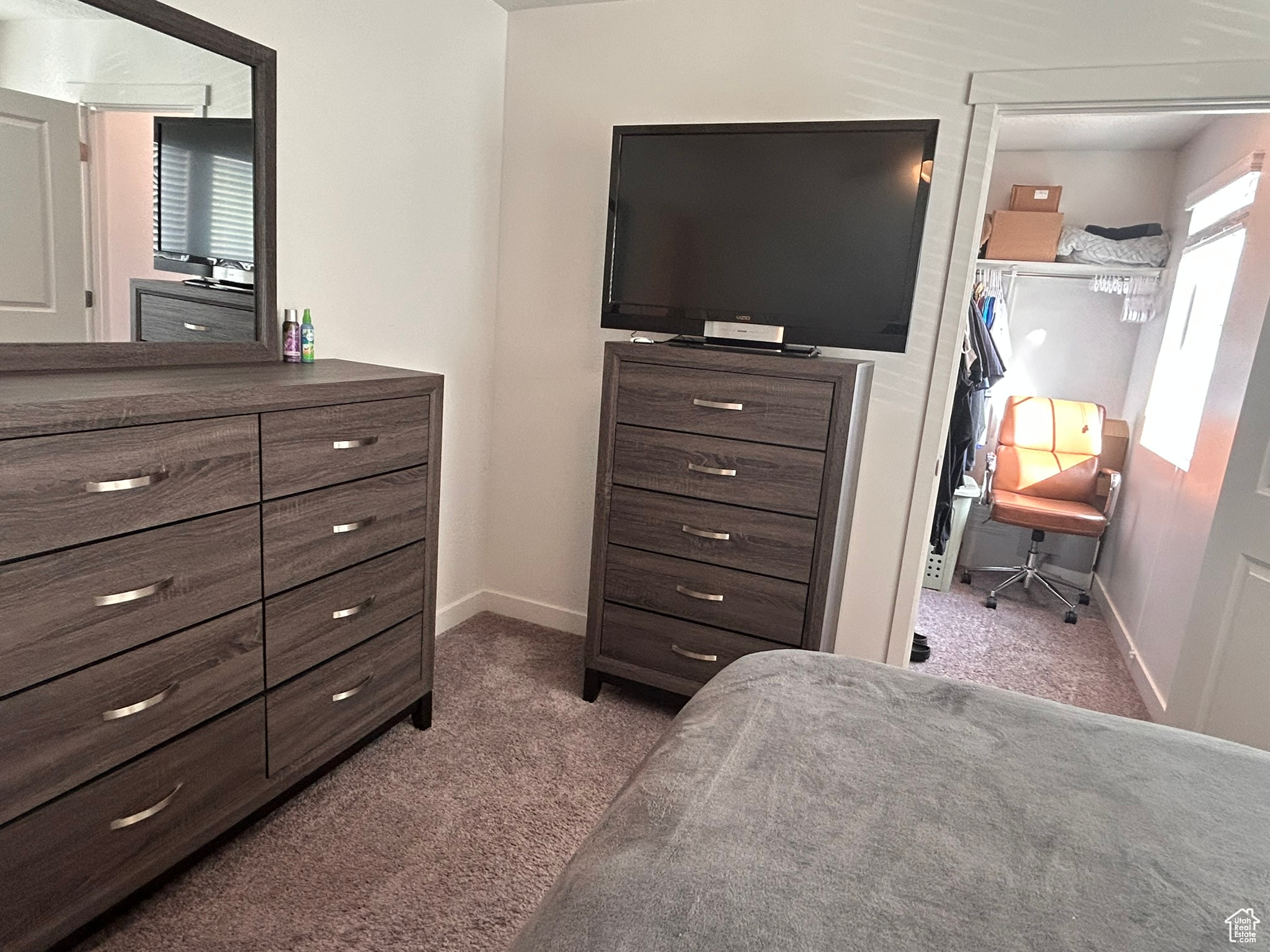 Bedroom featuring carpet flooring and a closet