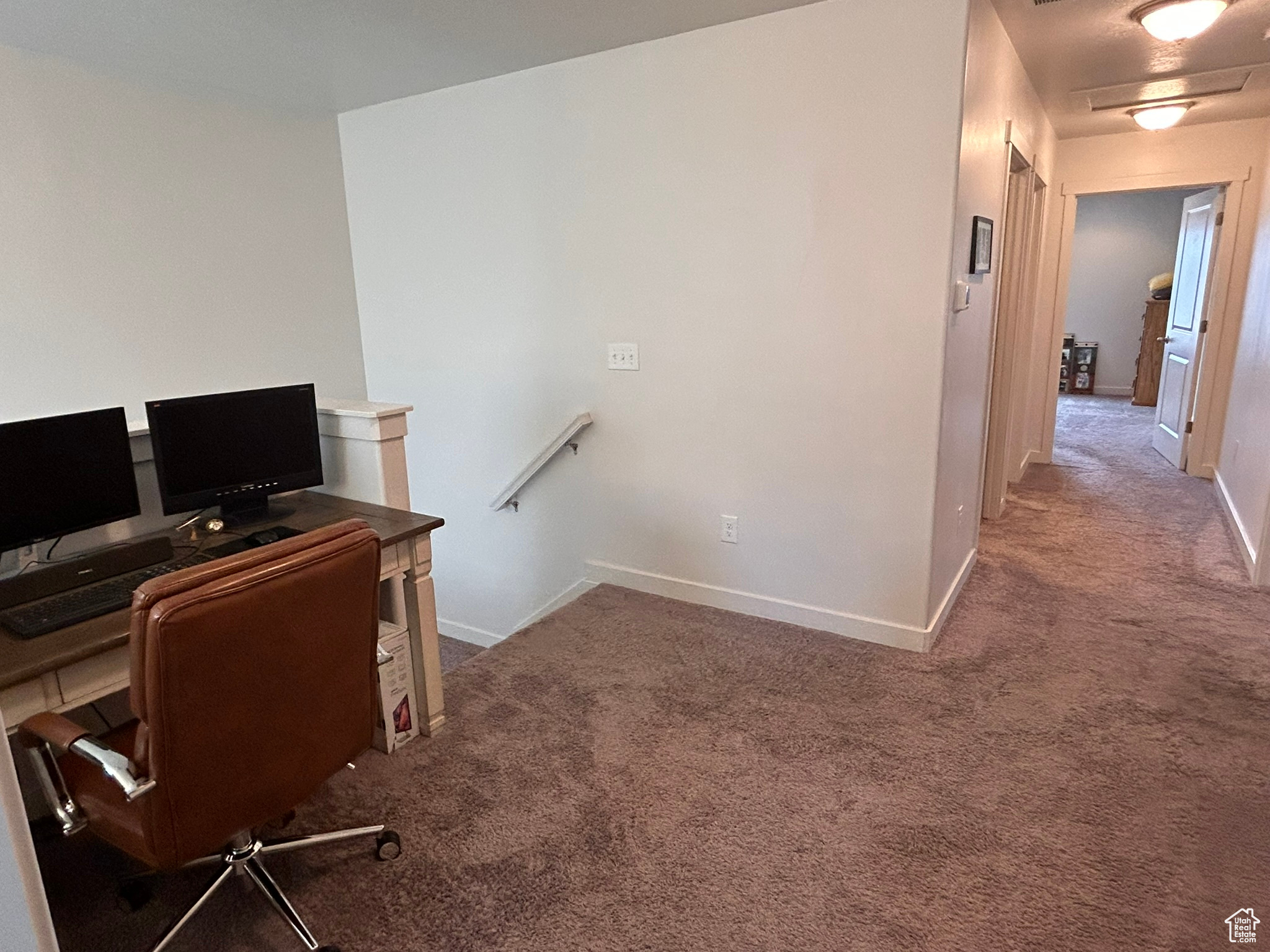 View of carpeted home office