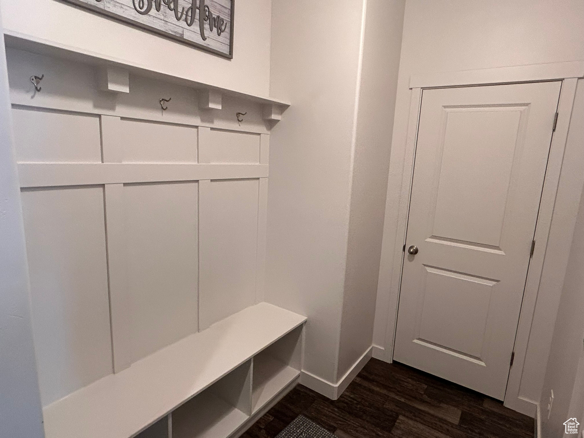 Mudroom with dark hardwood / wood-style floors