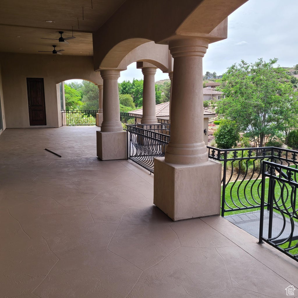 View of patio / terrace with a balcony spiral staircase that leads to the back yard.