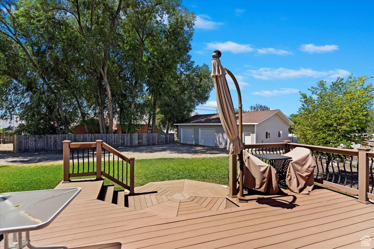 Deck featuring a yard