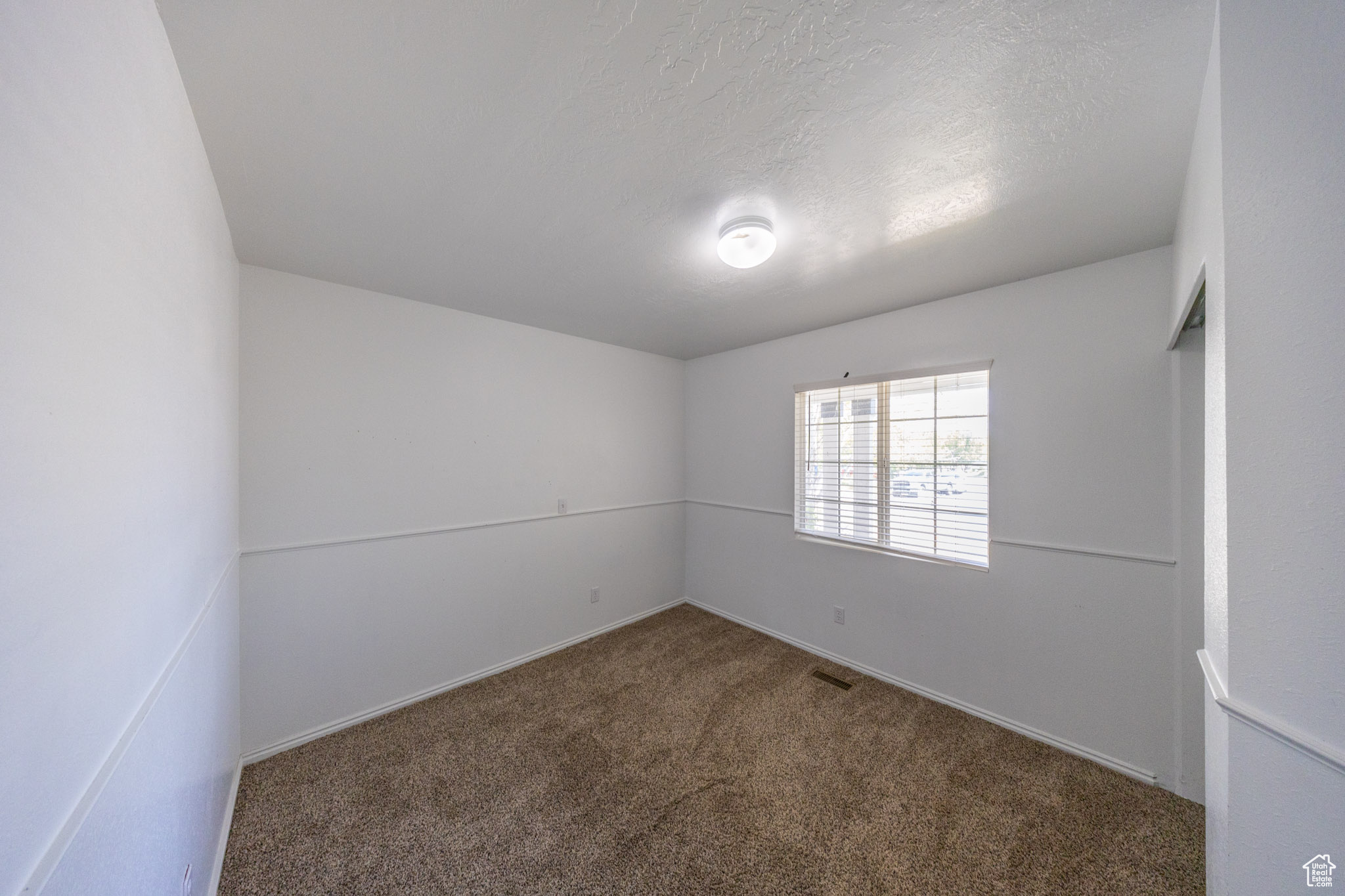 Bedroom #3 on main level. Faces front yard.