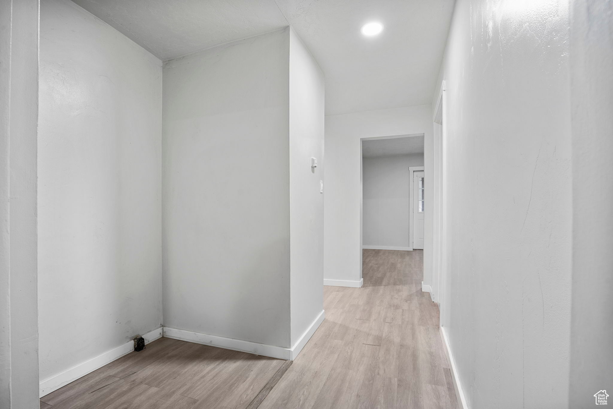 Hallway featuring light wood-type flooring