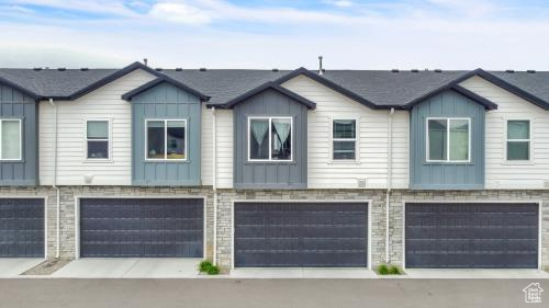 Townhome / multi-family property featuring a 2 car garage