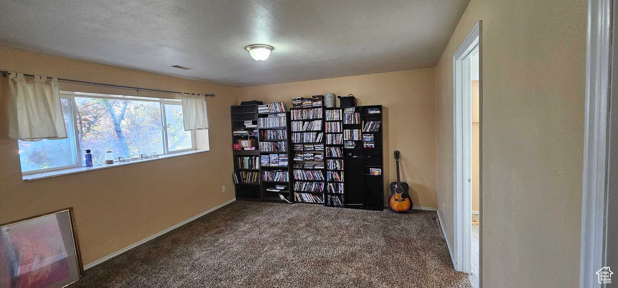 Miscellaneous room featuring carpet