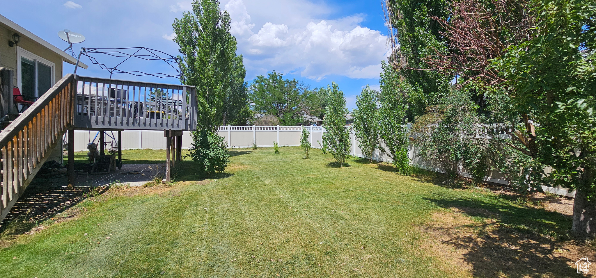 View of yard with a deck