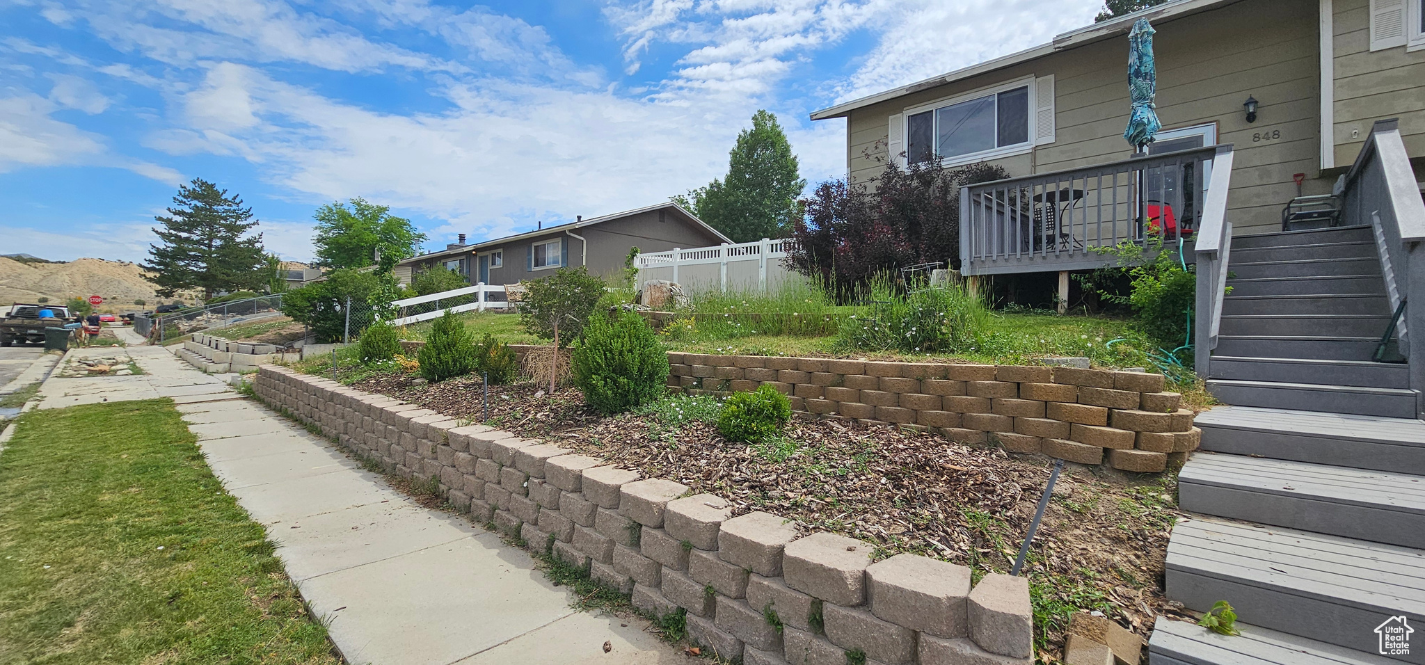 View of yard featuring a wooden deck