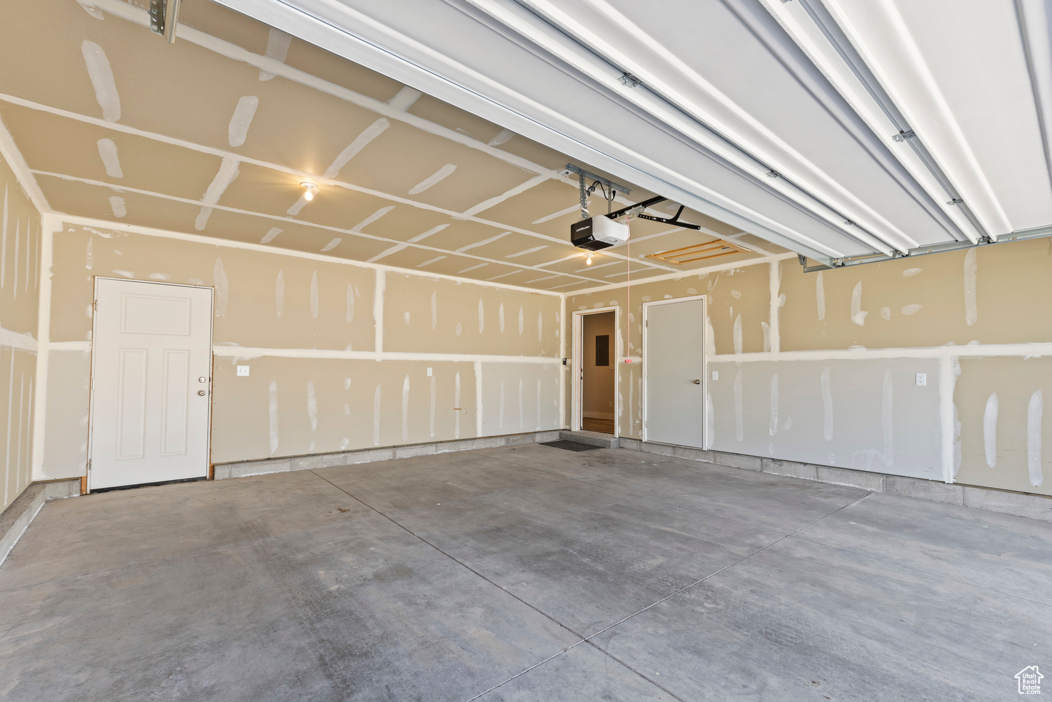 Garage featuring a garage door opener