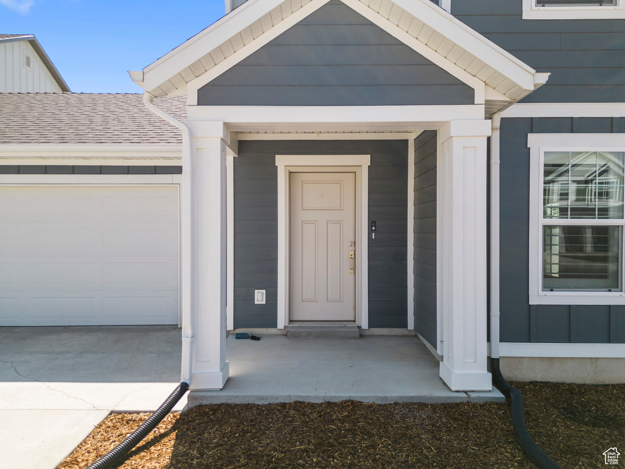 Property entrance featuring a garage