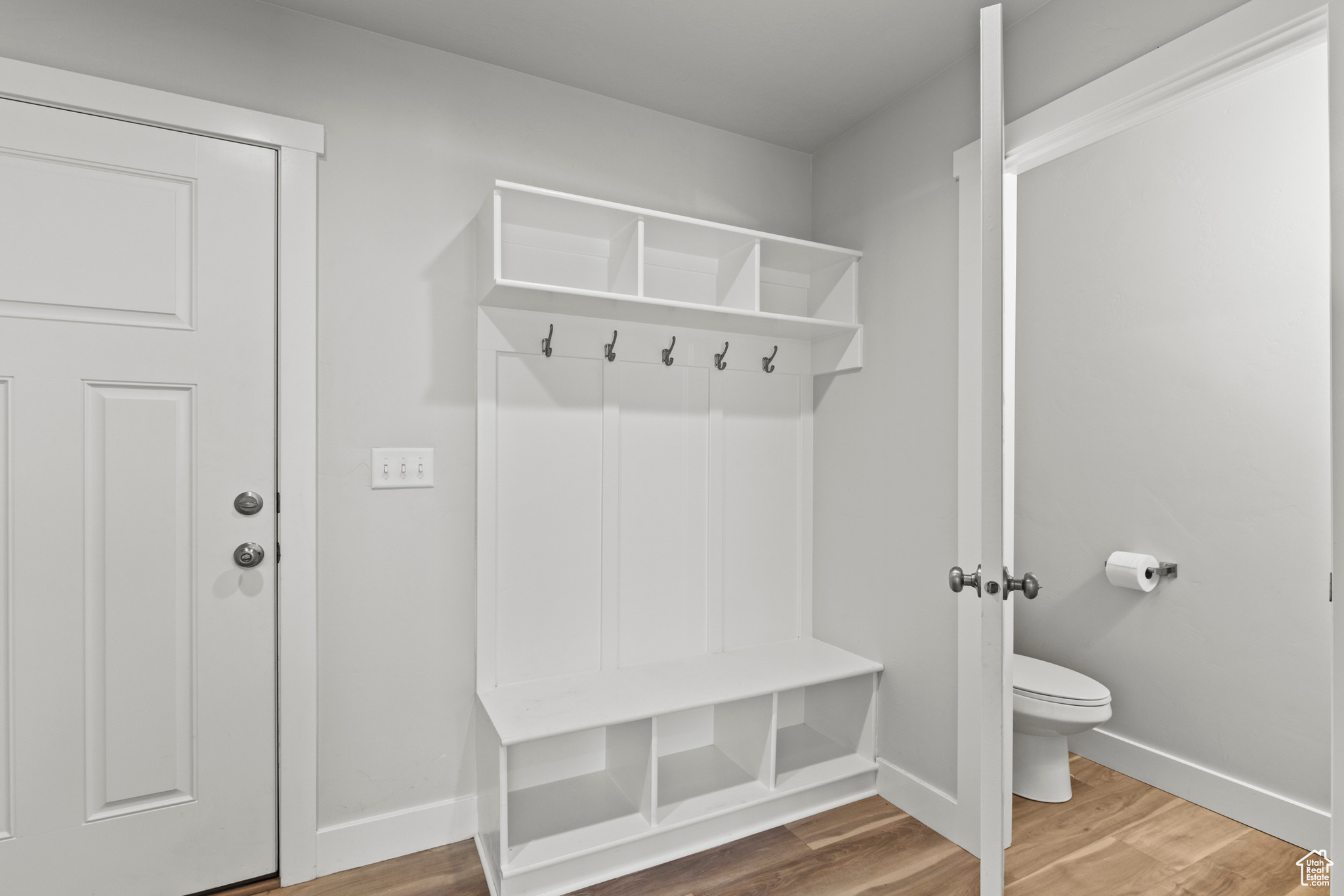 Mudroom featuring wood-type flooring