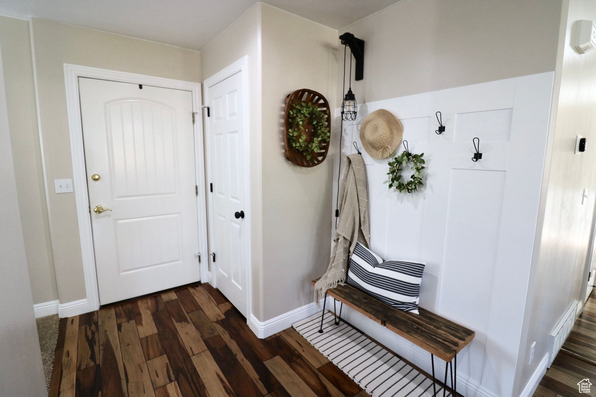 Mudroom with dark wood-type flooring