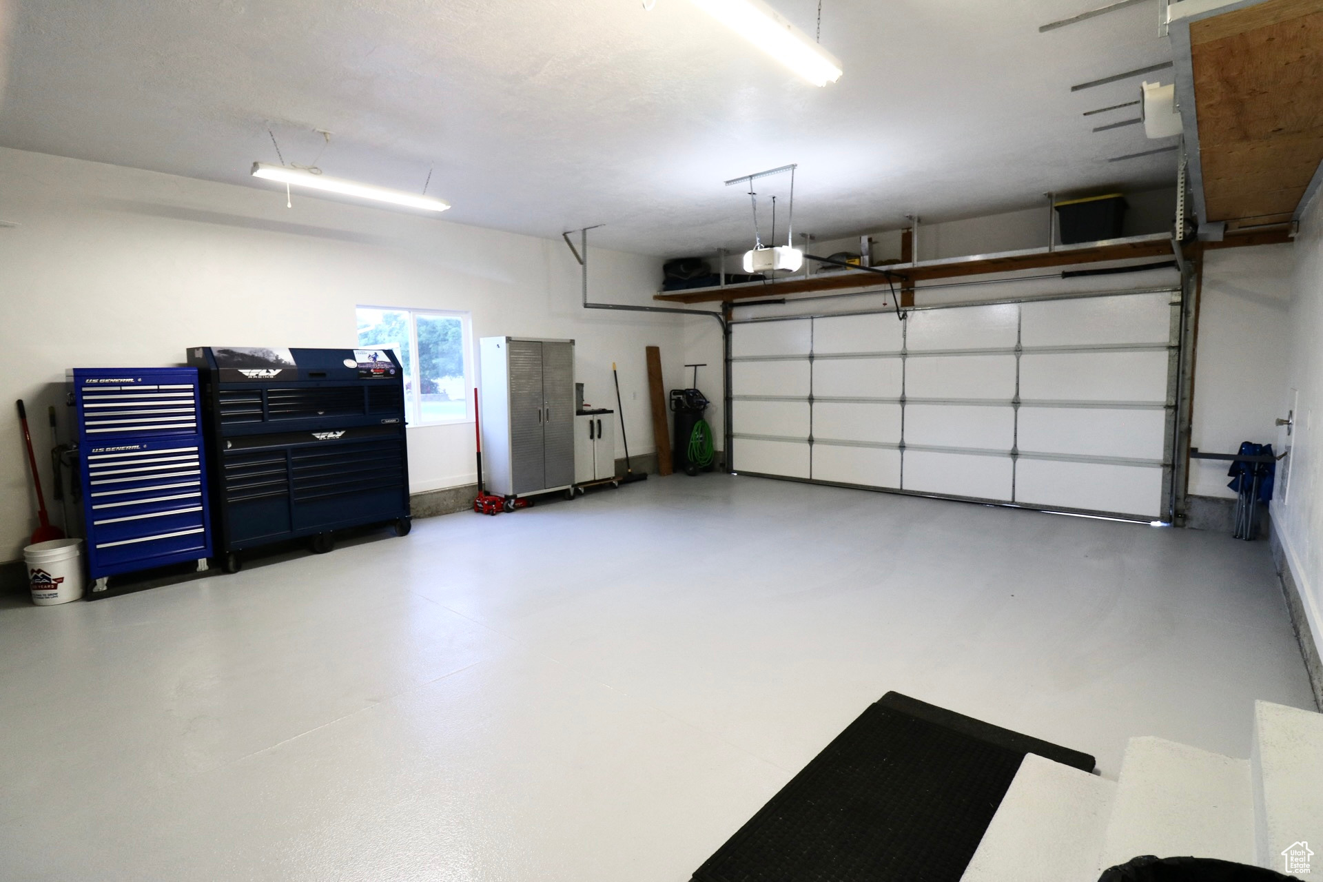 Garage featuring a garage door opener