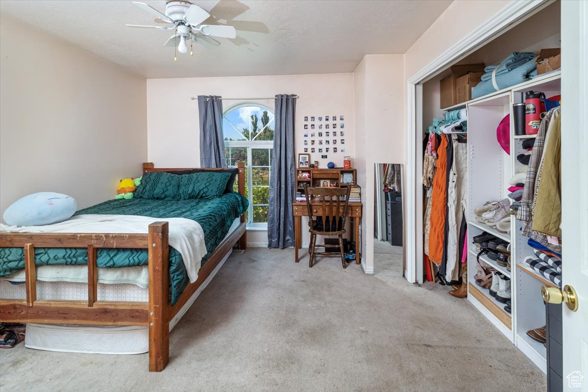 Bedroom 2 featuring a closet and ceiling fan