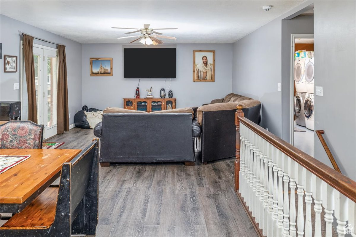 Family room with ceiling fan and hardwood / wood-style floors