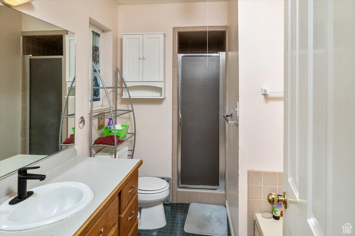 Master bathroom with an enclosed shower, vanity, and separate soaking tub