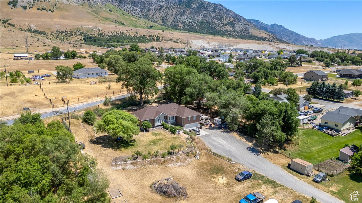 Birds eye view of property with a mountain view