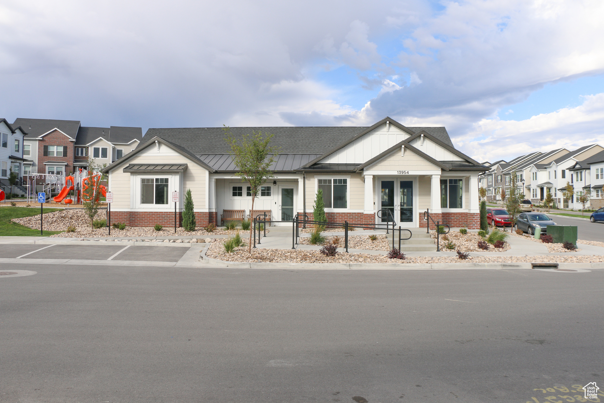 View of front of property with a playground