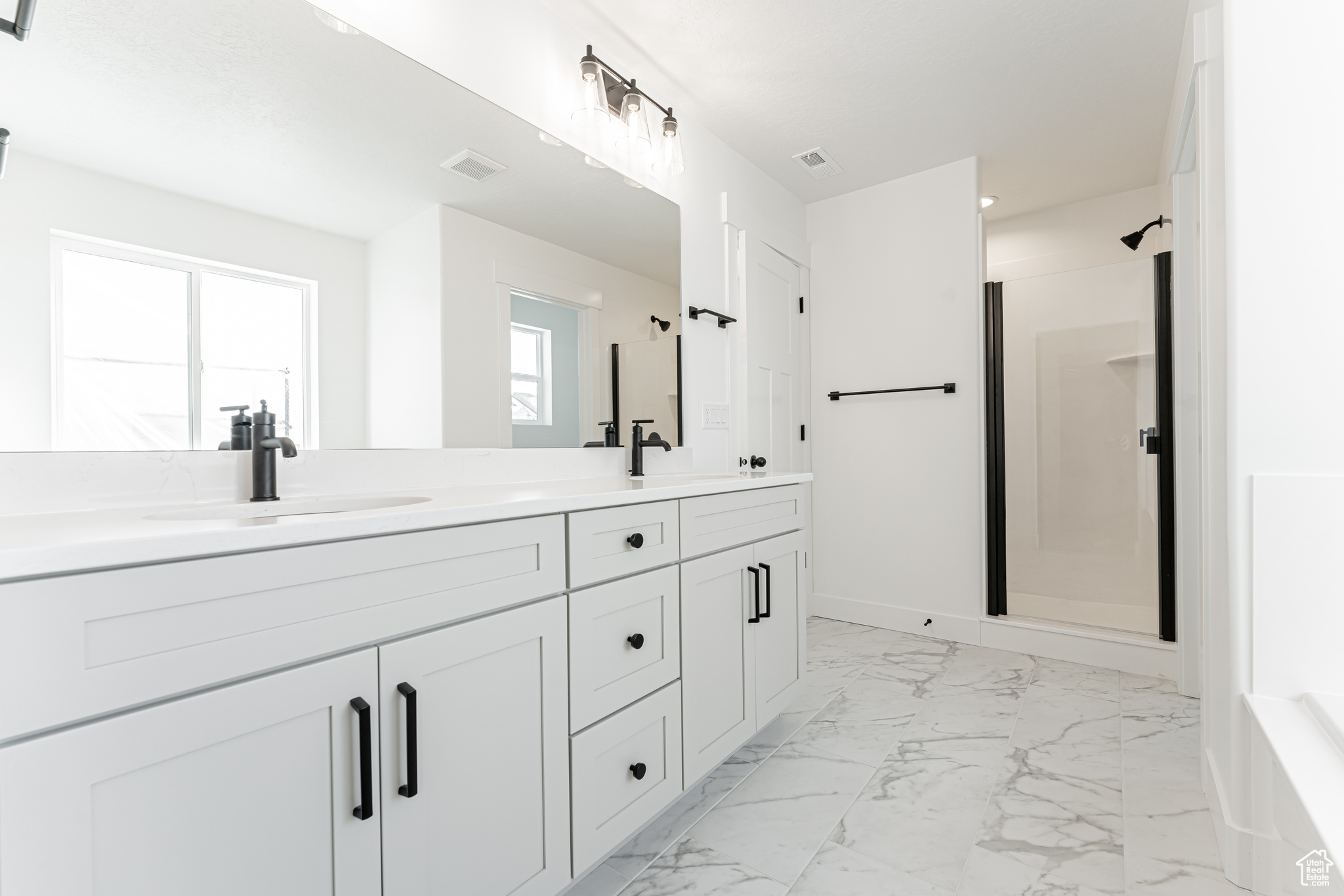 Bathroom with vanity and walk in shower