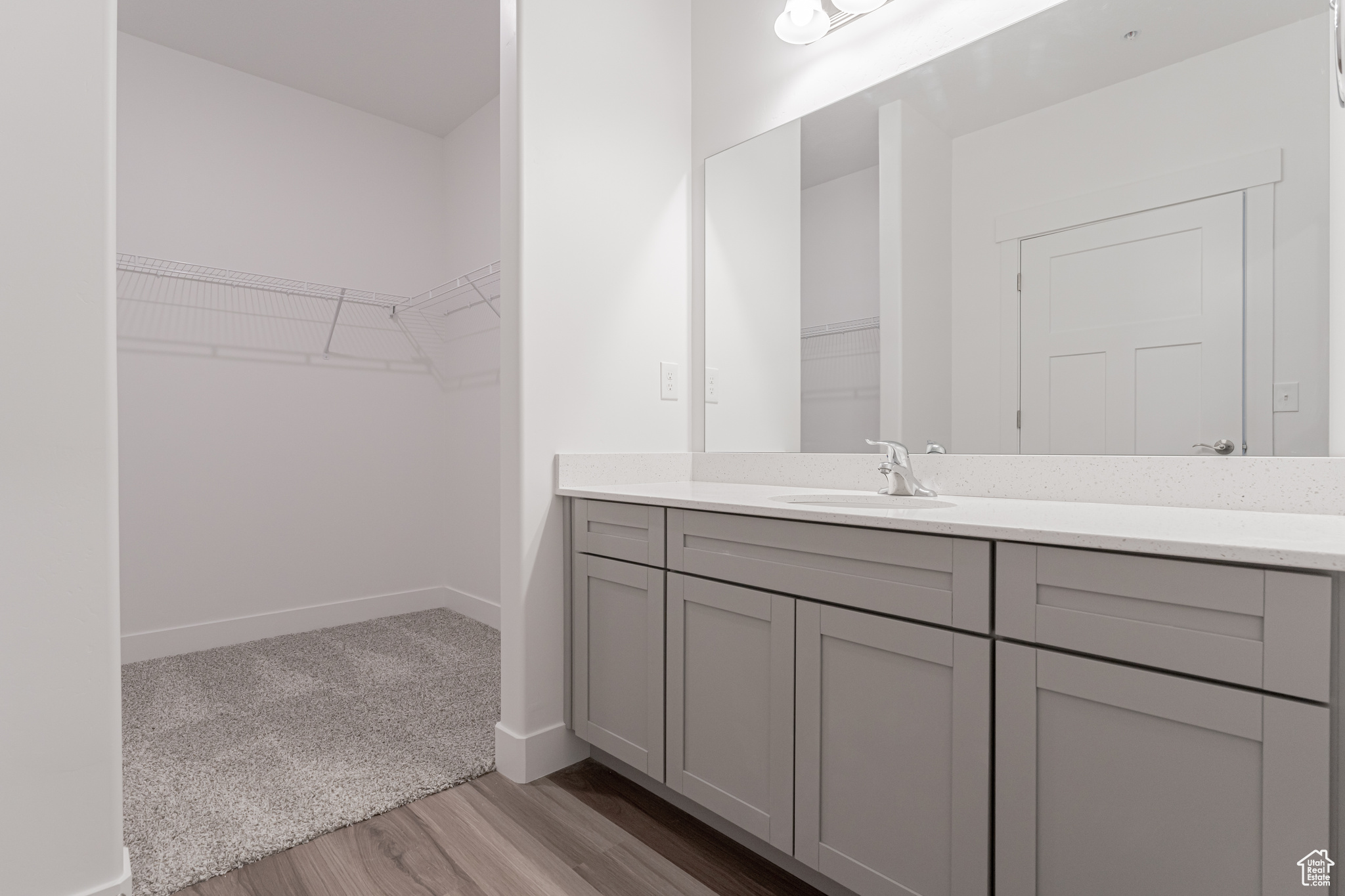 Bathroom featuring hardwood / wood-style floors and vanity