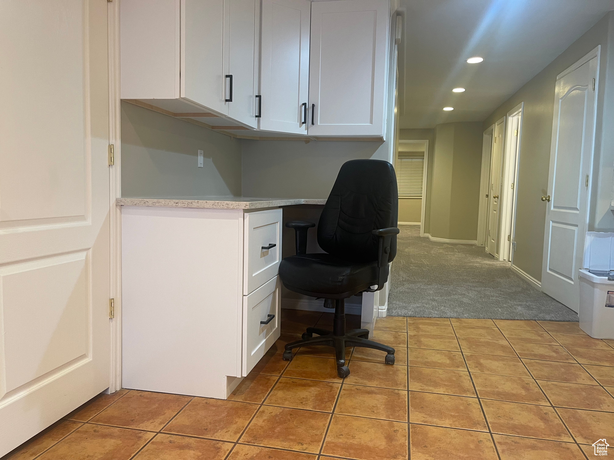 Tiled office featuring built in desk