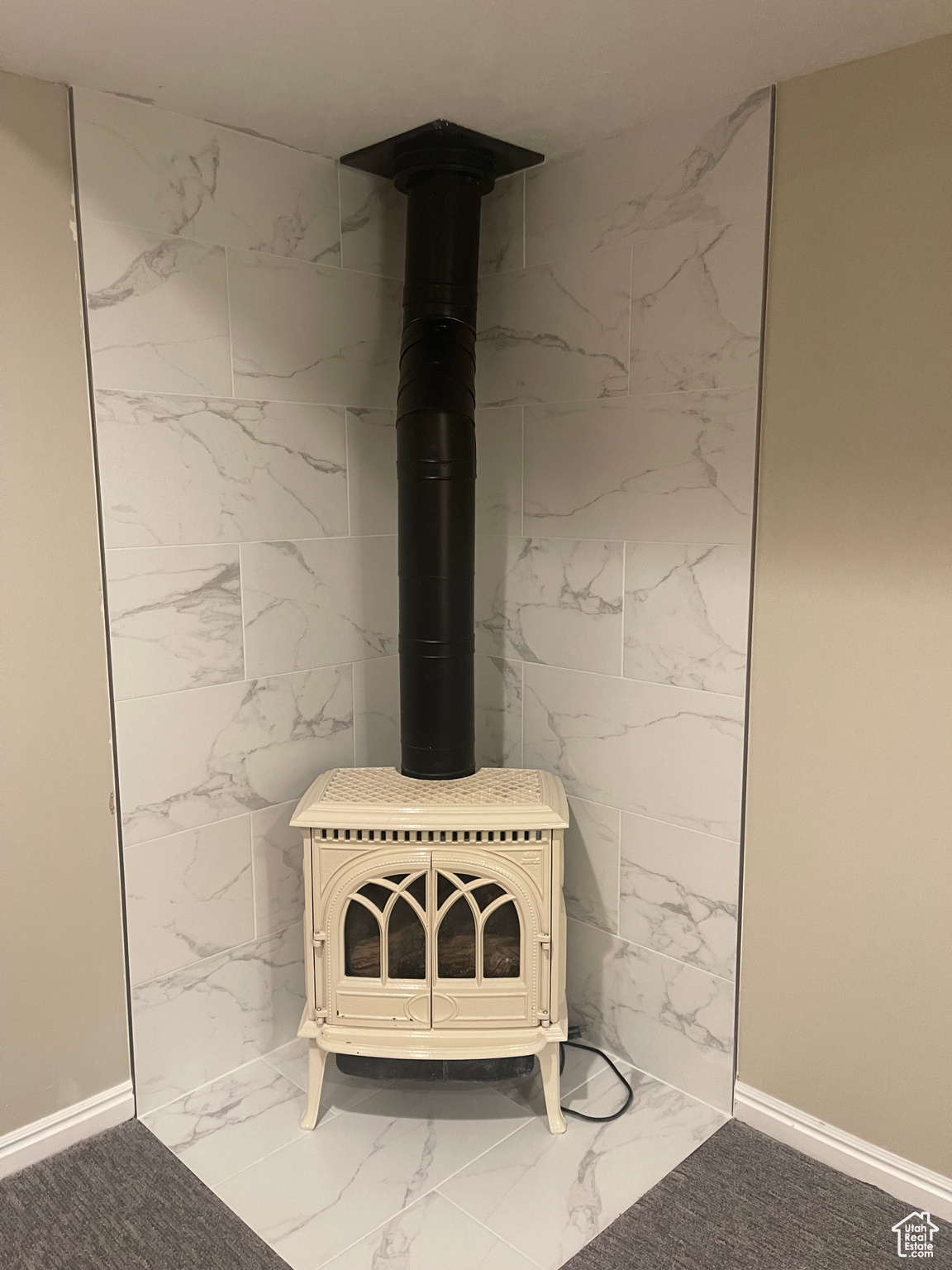 Primary BedroomInterior details featuring a gas stove and tile patterned flooring