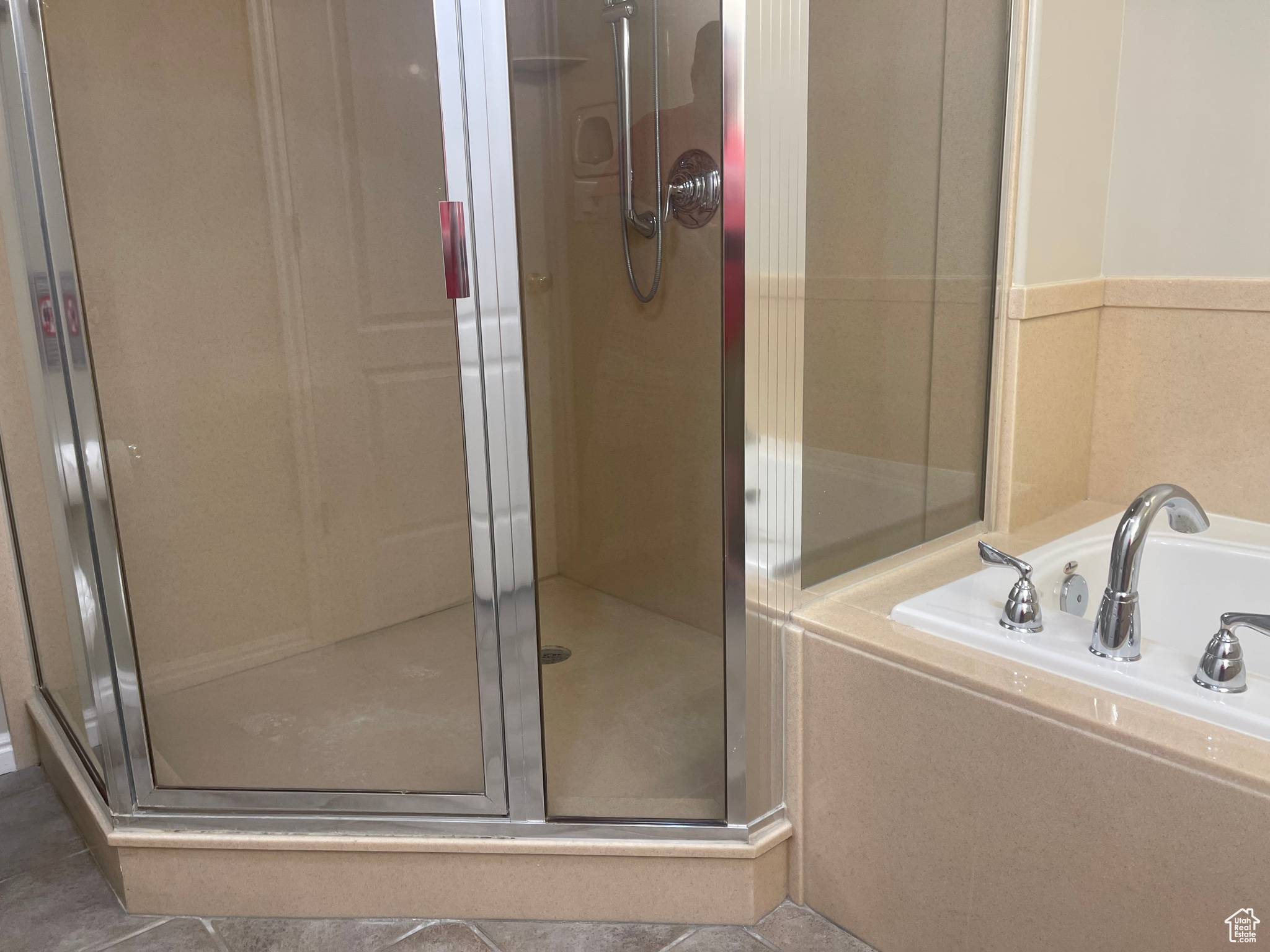 Primary Bathroom featuring shower with separate bathtub and tile patterned floors