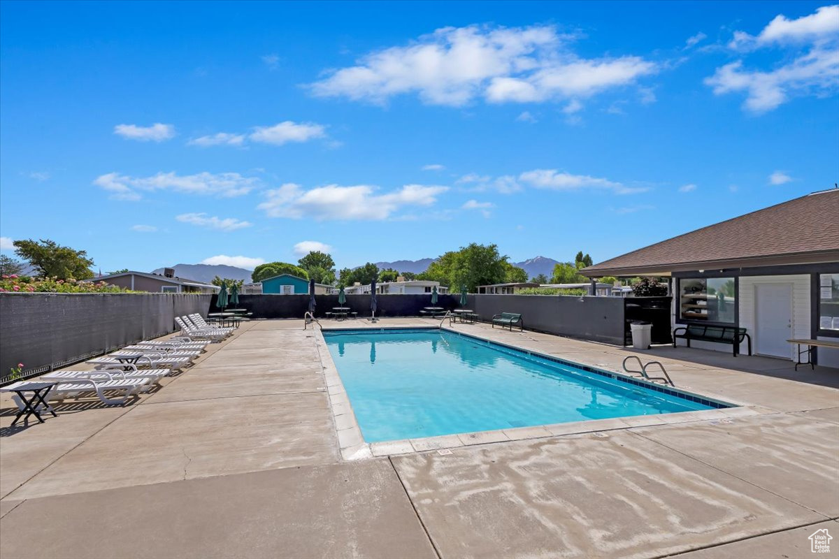 View of swimming pool with a patio