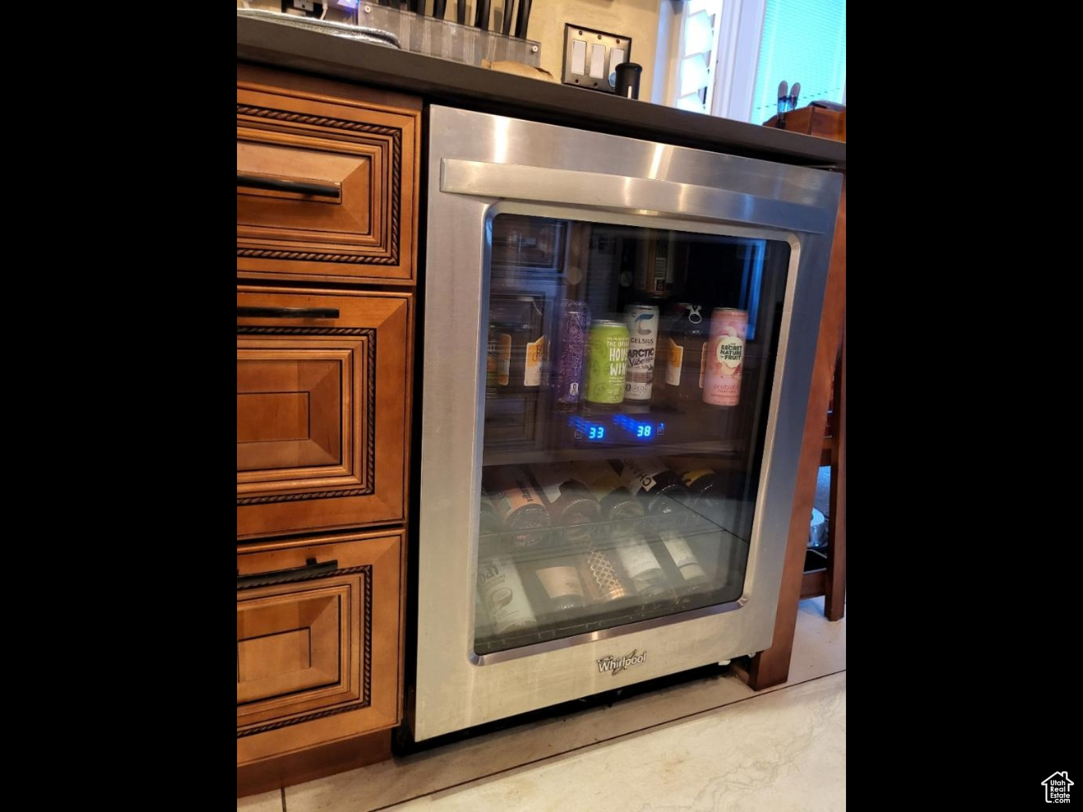 Beverage center refrigerator mounted under the countertop