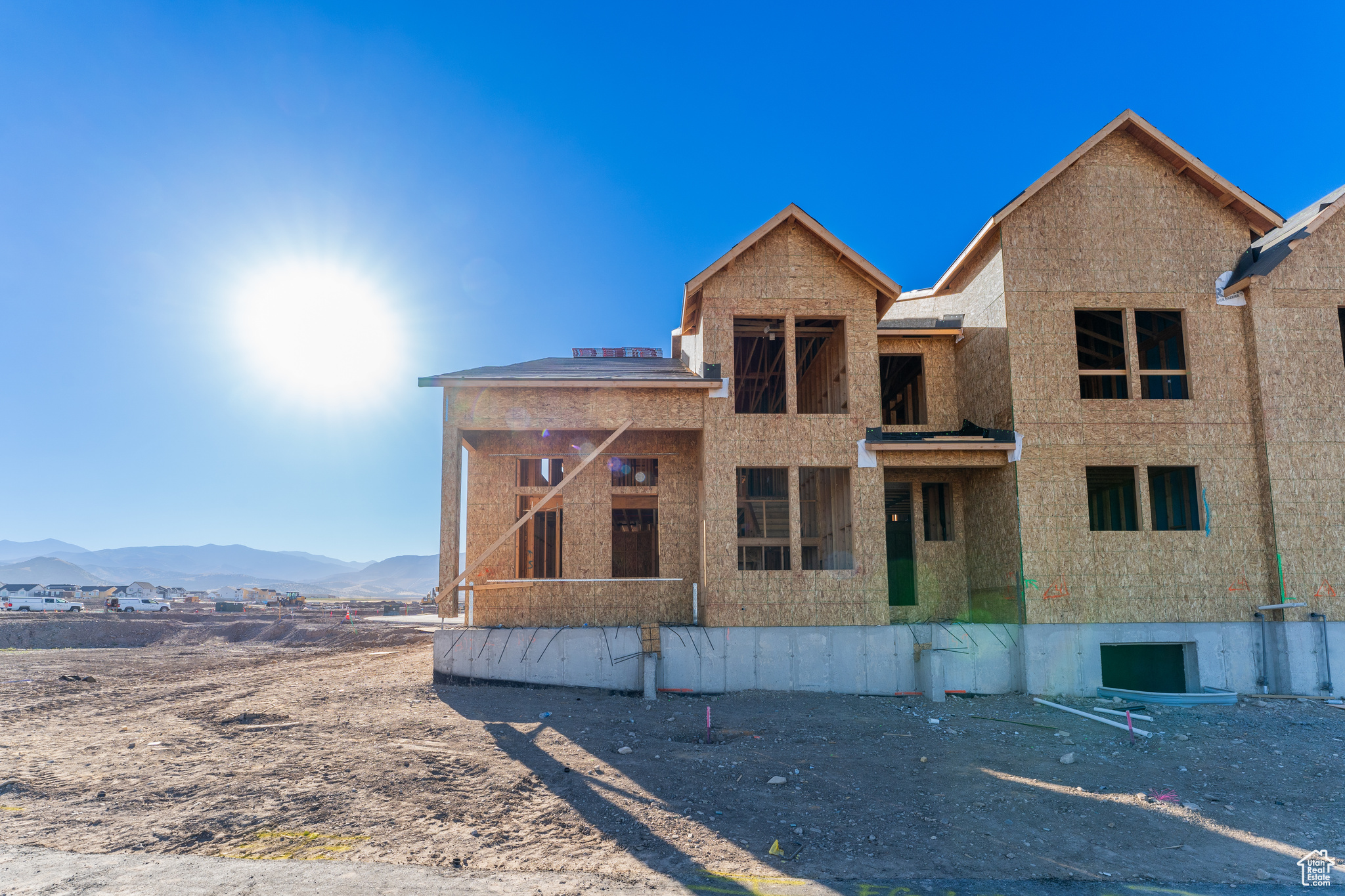 View of front of home featuring a balcony and a mountain view