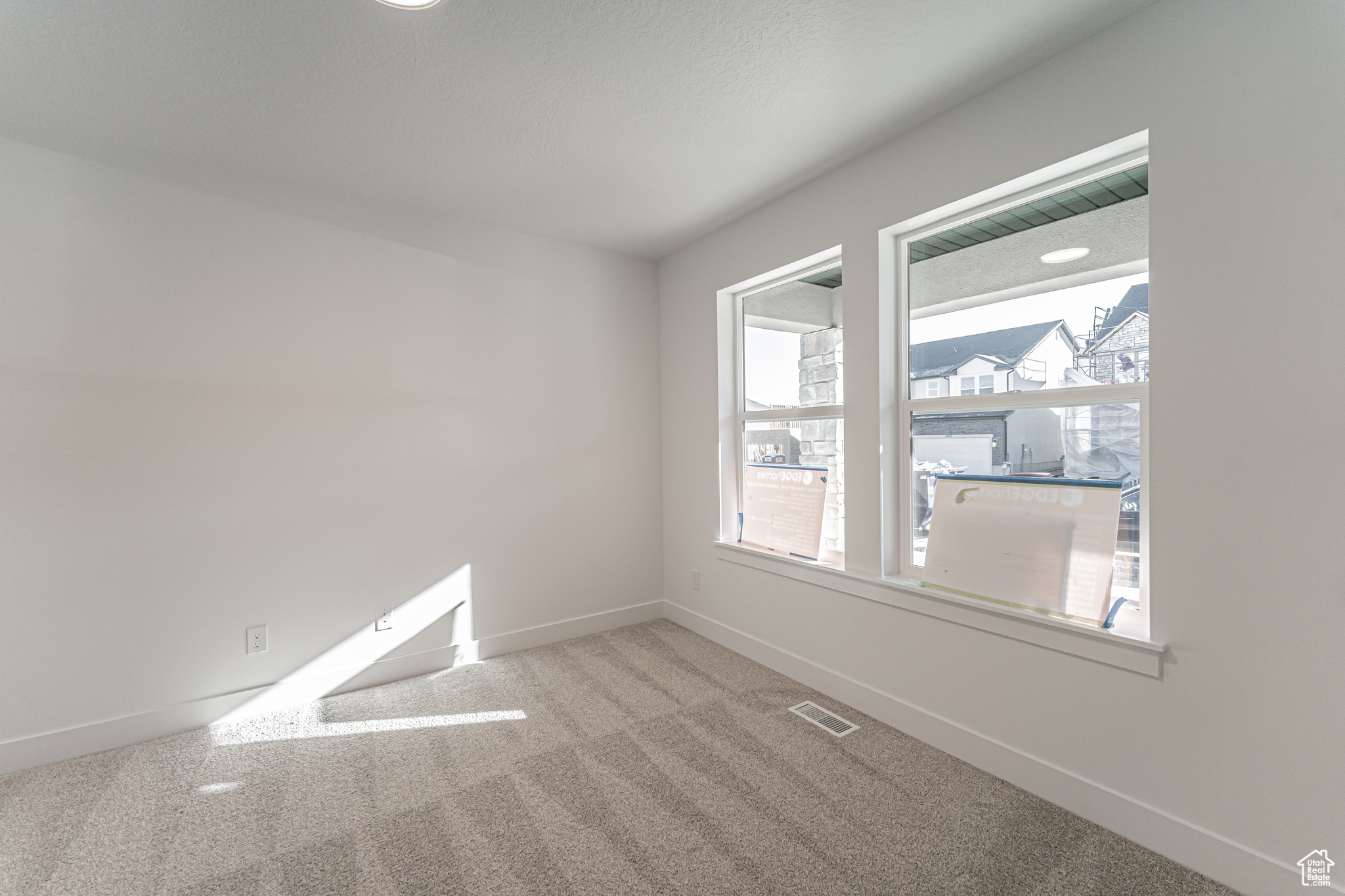 View of carpeted spare room