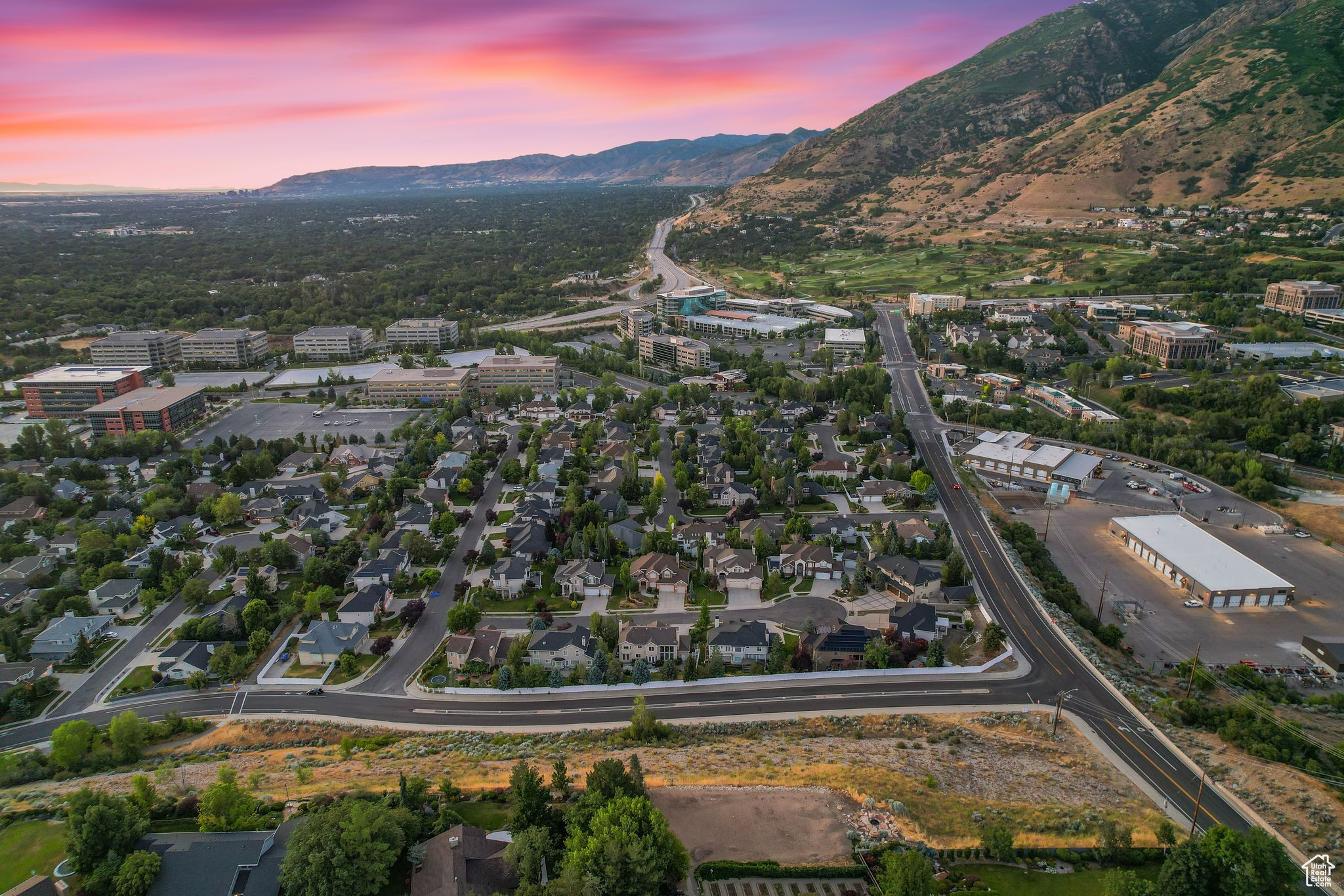 Aerial view at dusk featuring a mountain view