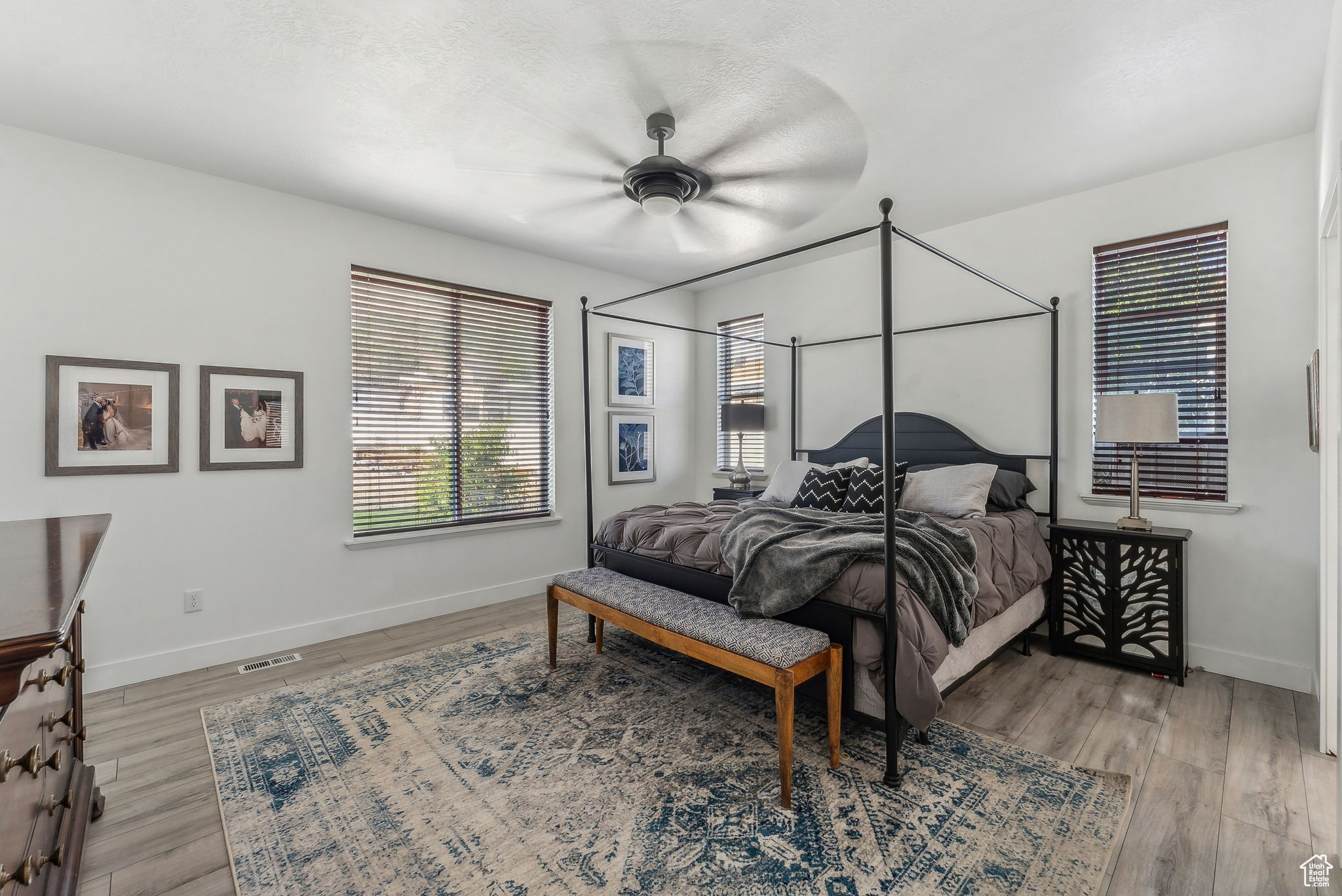 Bedroom with hardwood / wood-style flooring and ceiling fan