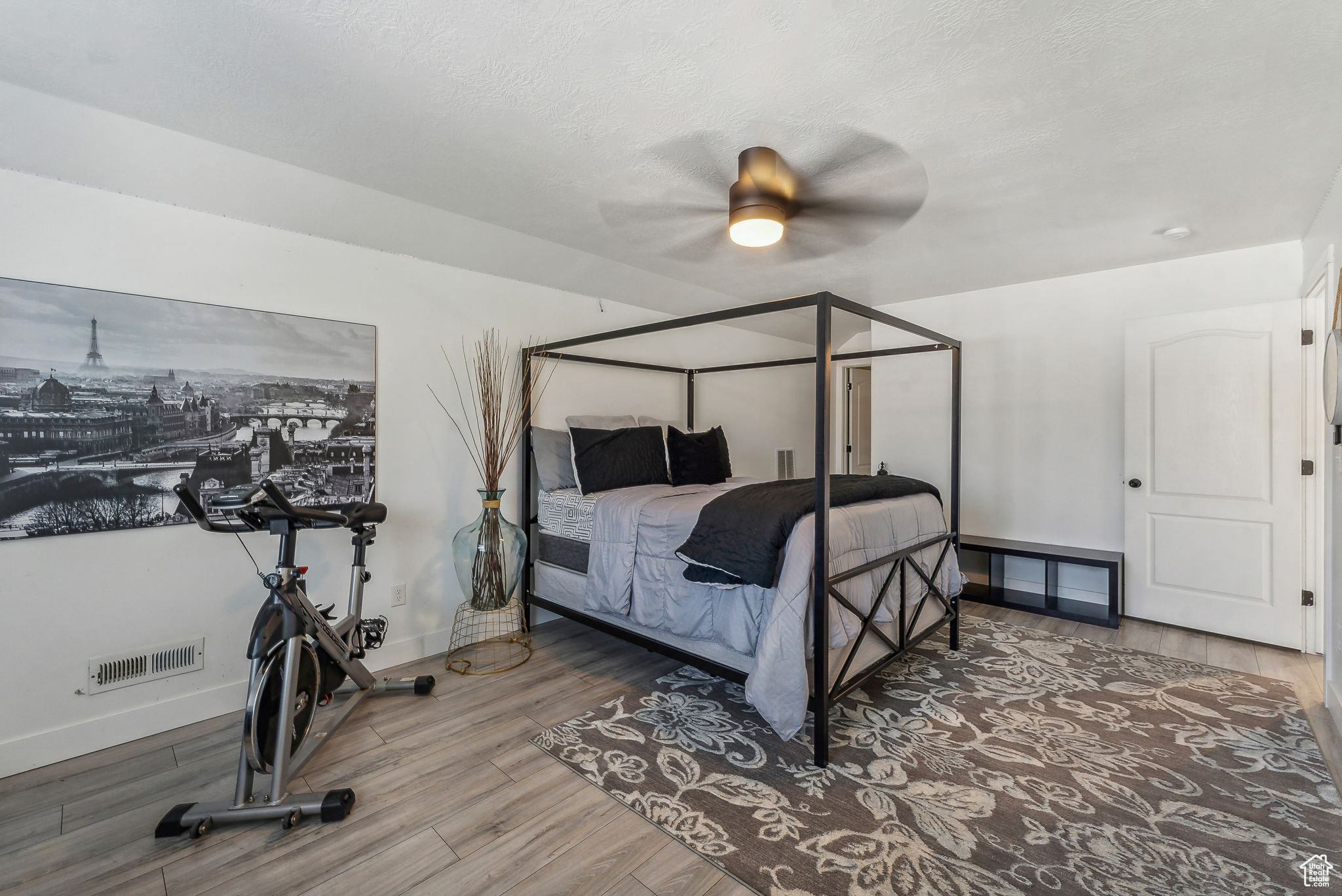 Bedroom with hardwood / wood-style flooring and ceiling fan