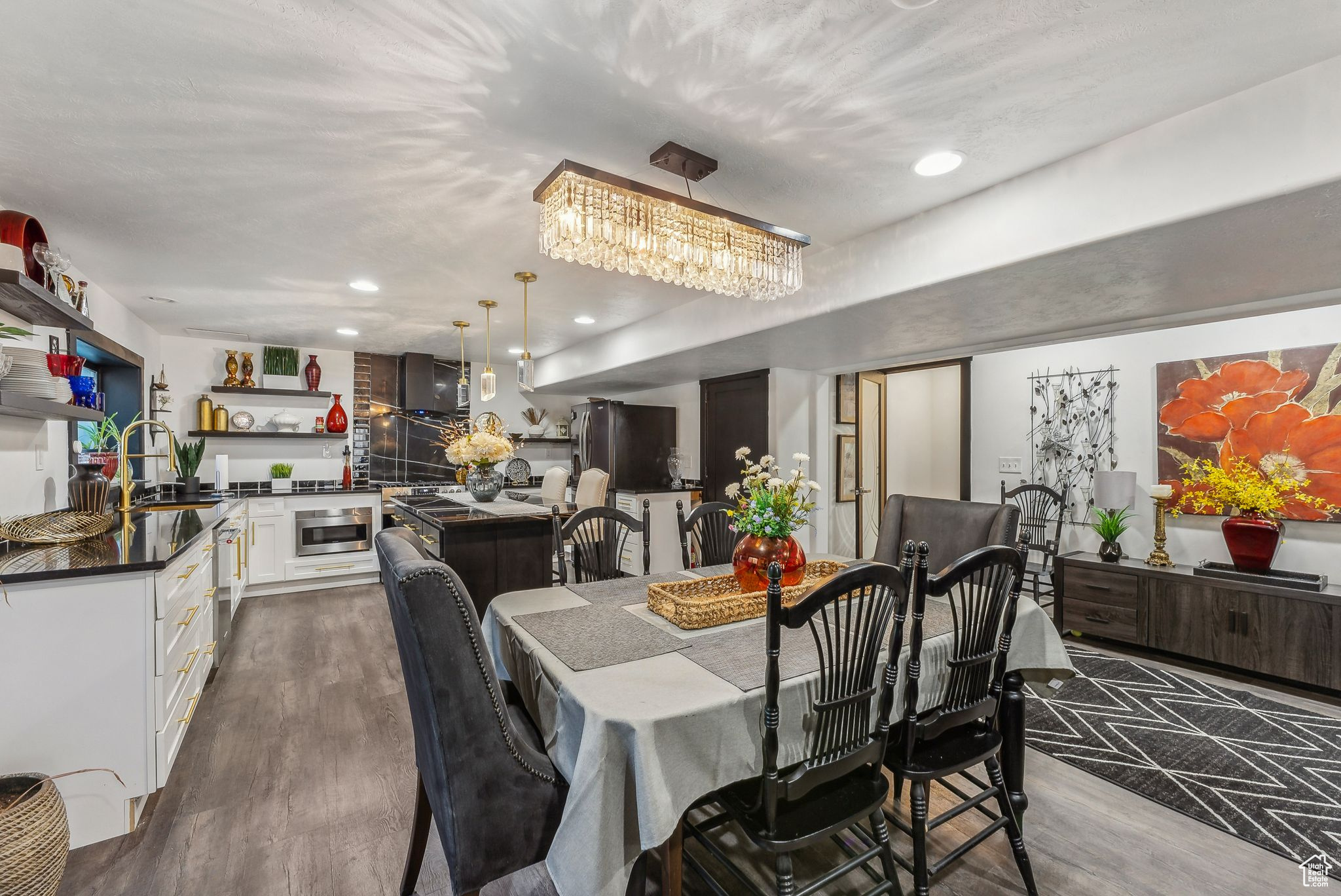 Dining space with dark hardwood / wood-style flooring and sink