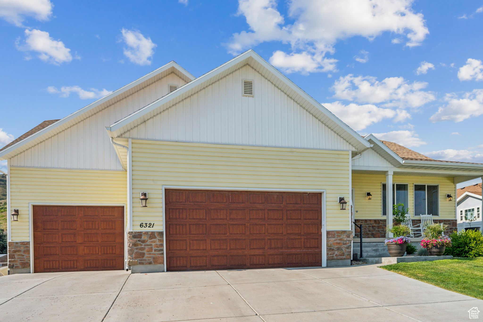 Craftsman-style home with a garage and covered porch