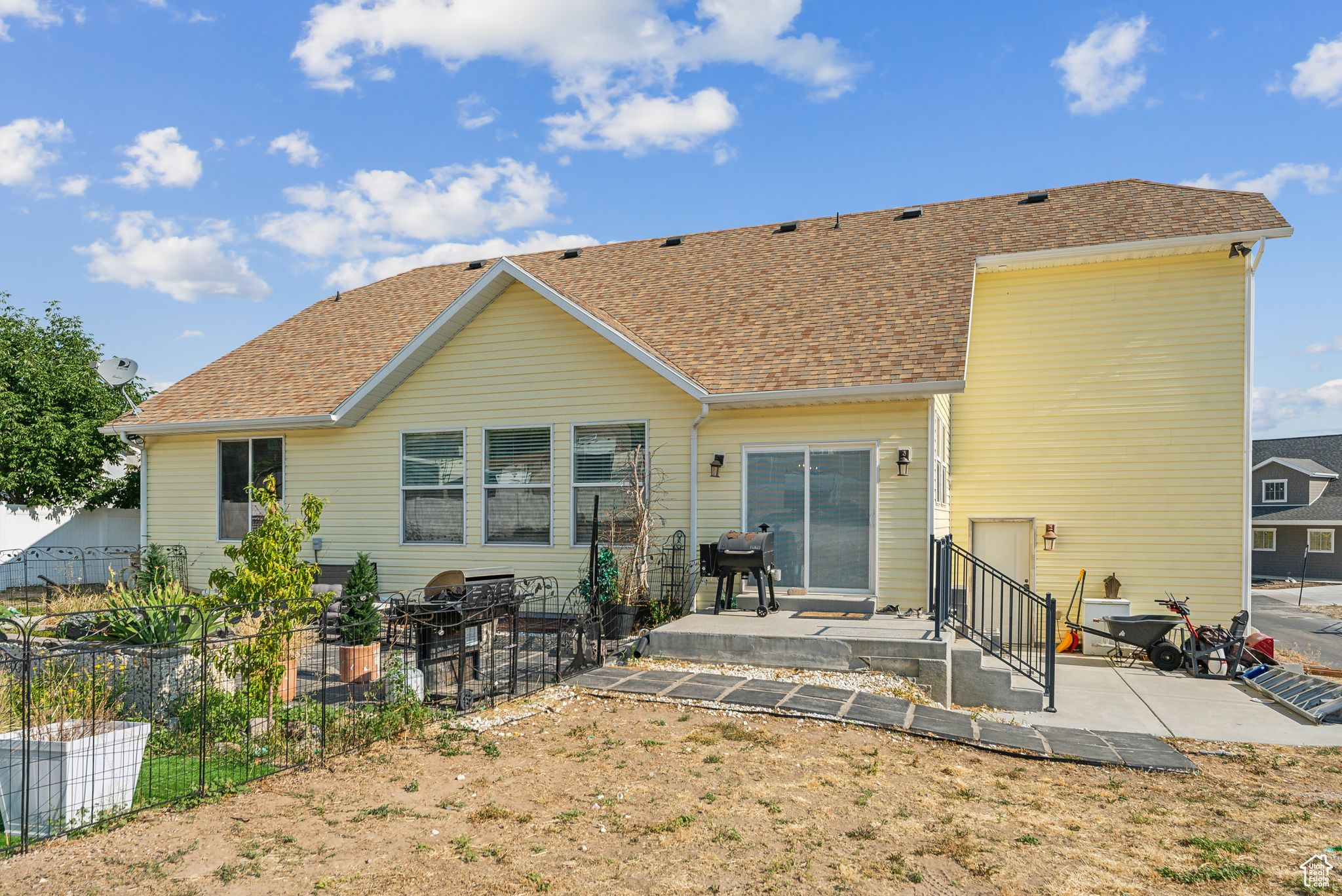 Back of property with a patio