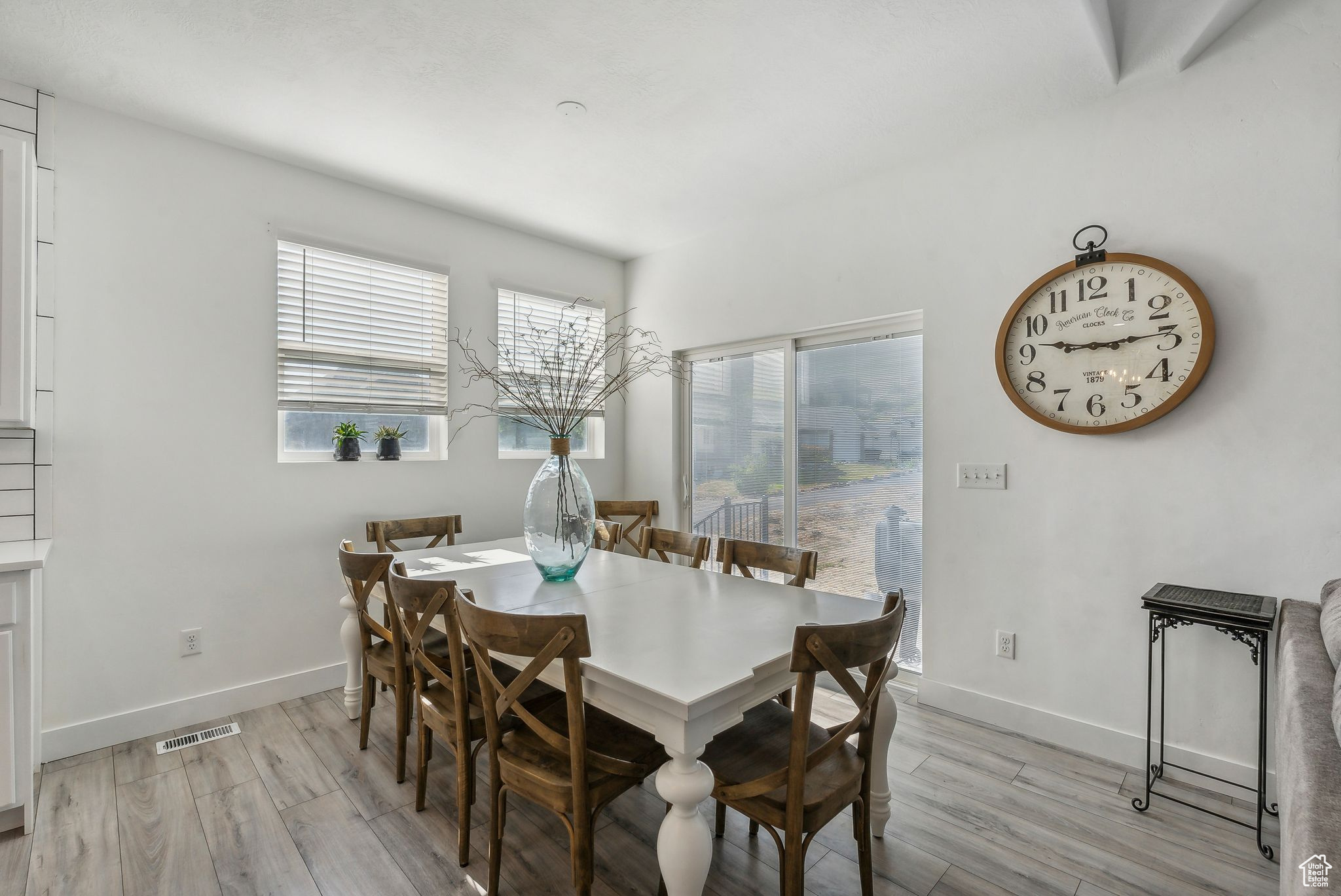 Dining area with light hardwood / wood-style floors