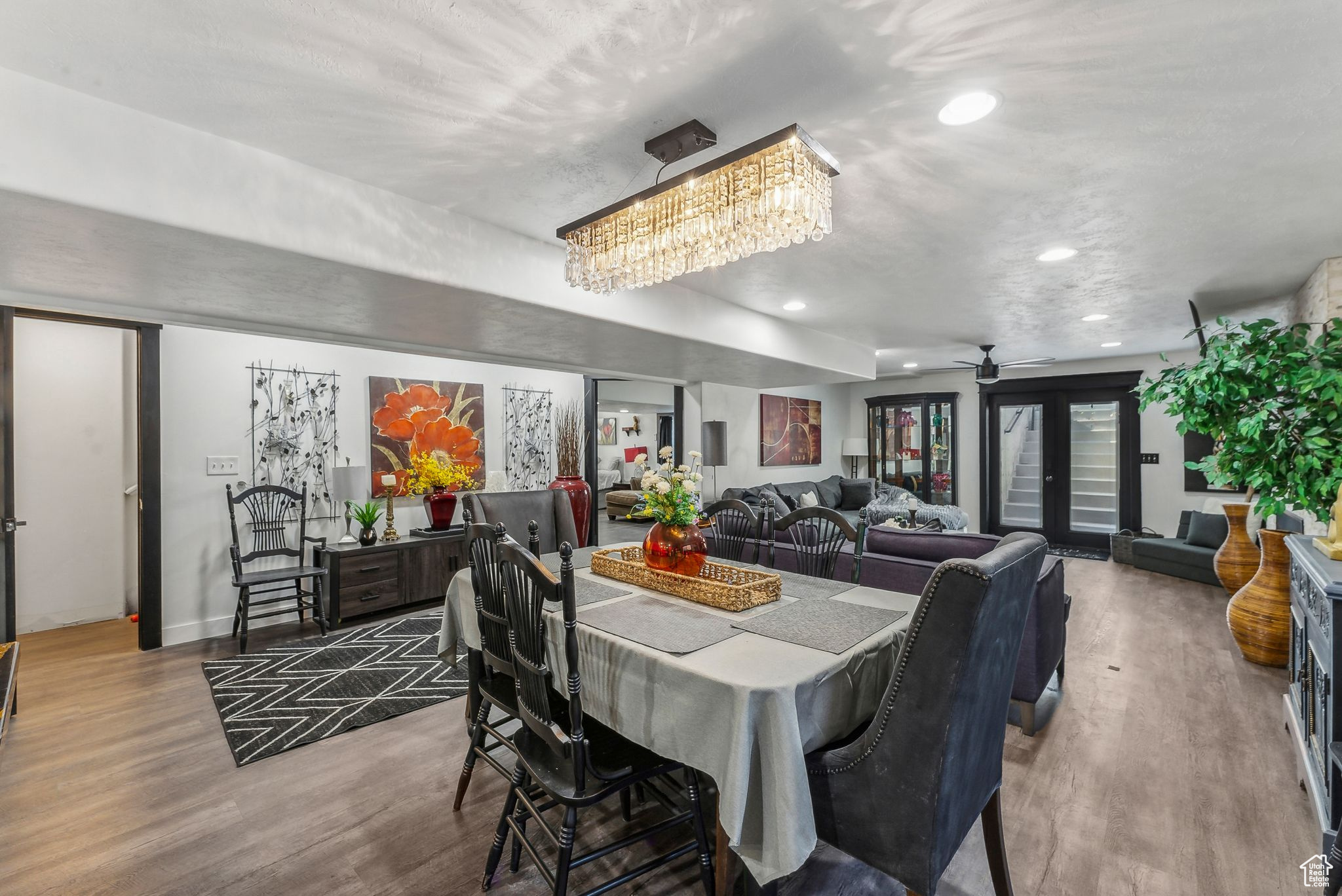 Dining room with hardwood / wood-style flooring, french doors, and ceiling fan