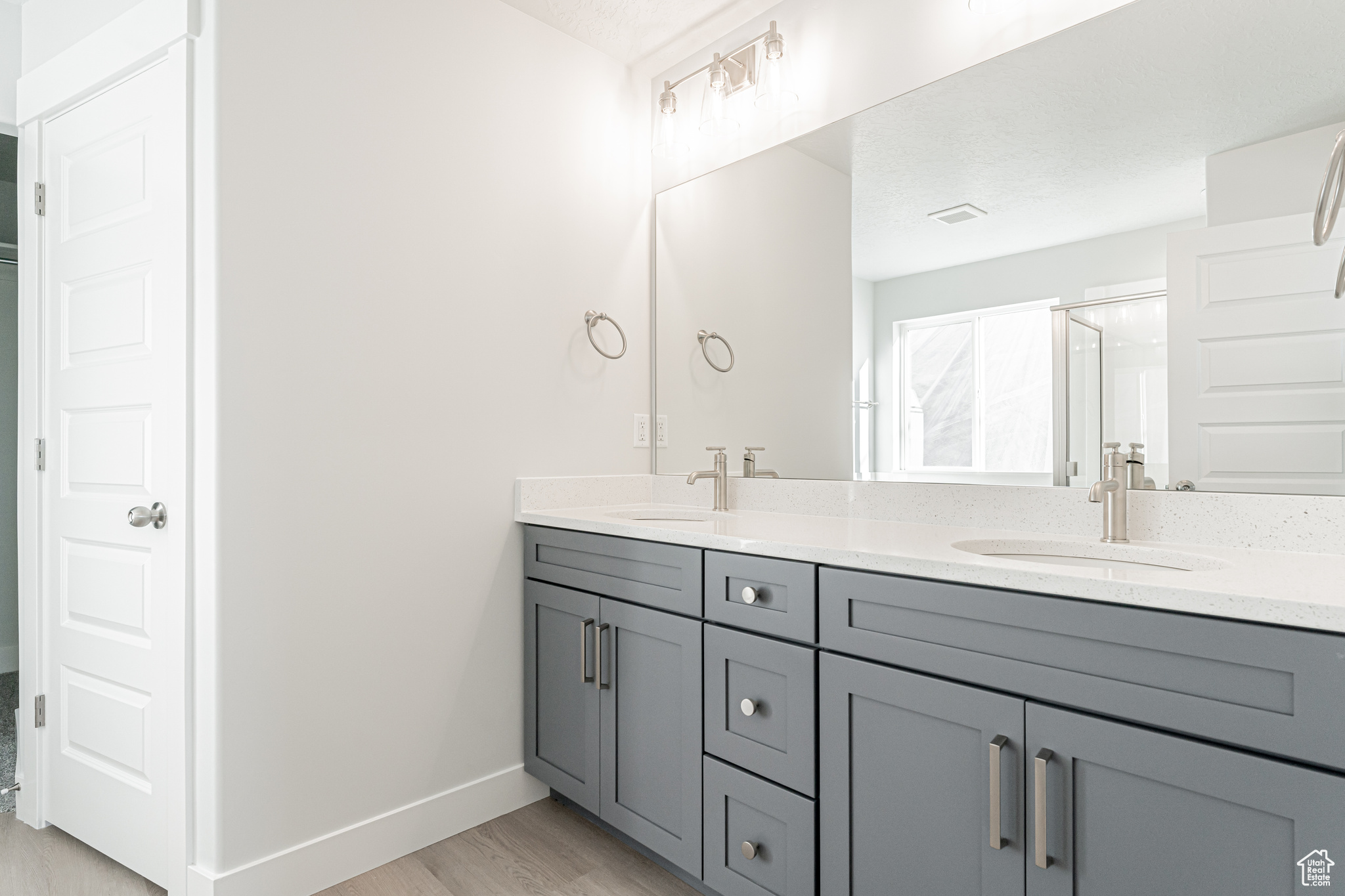 Bathroom featuring vanity and hardwood / wood-style floors