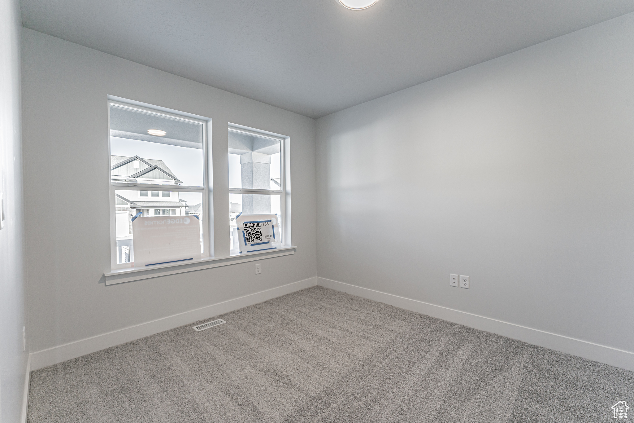 View of carpeted spare room