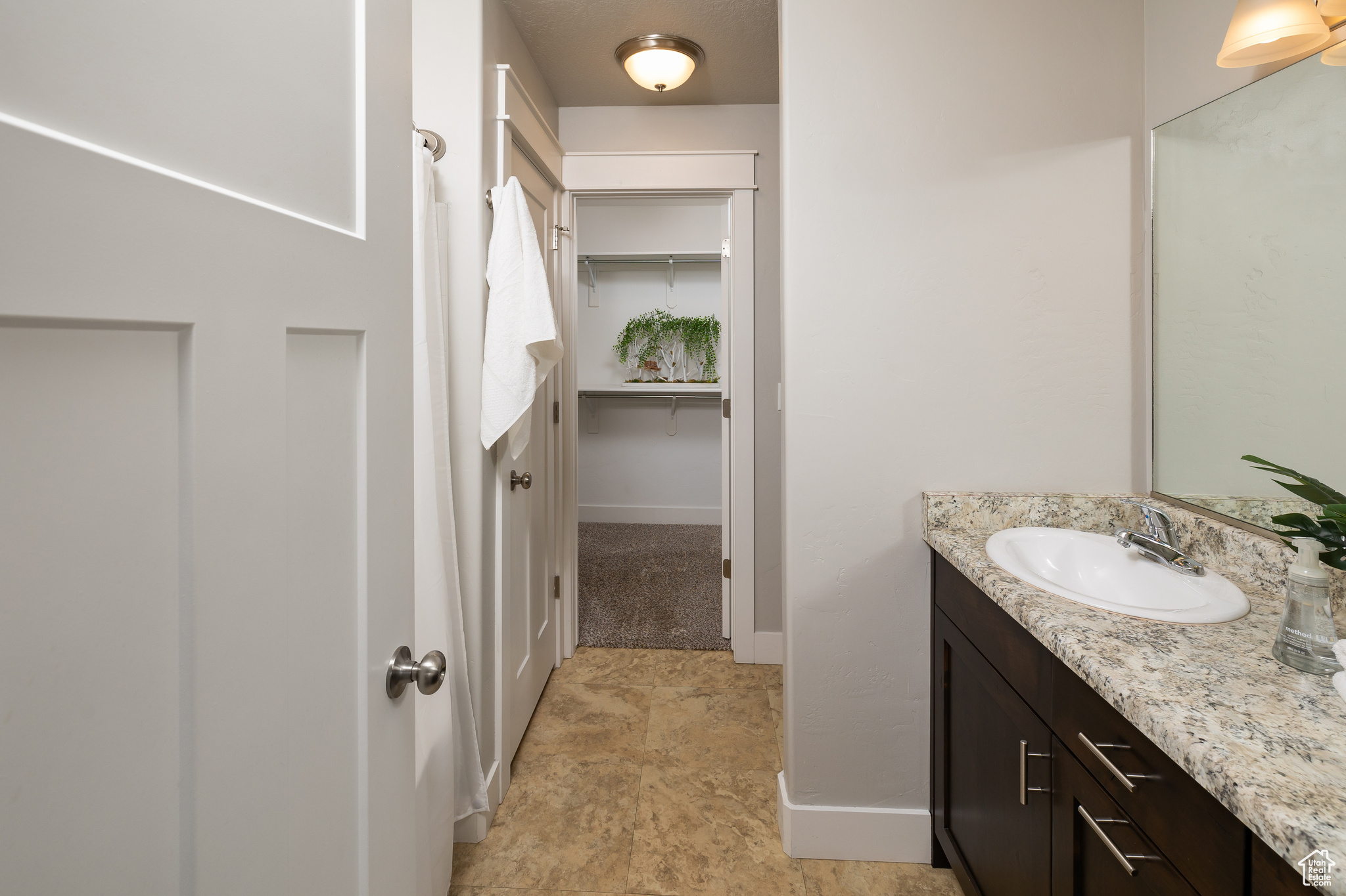 Bathroom featuring vanity and tile patterned flooring