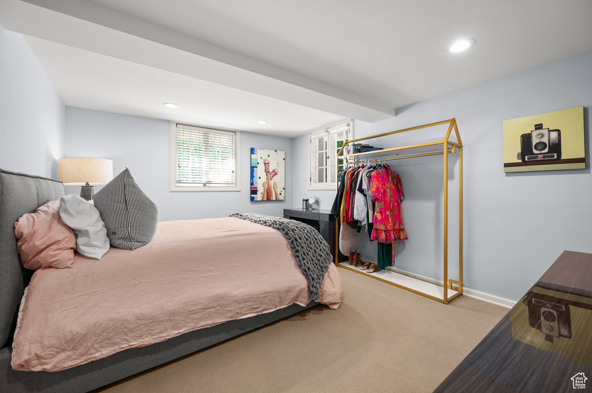 Carpeted bedroom with a closet