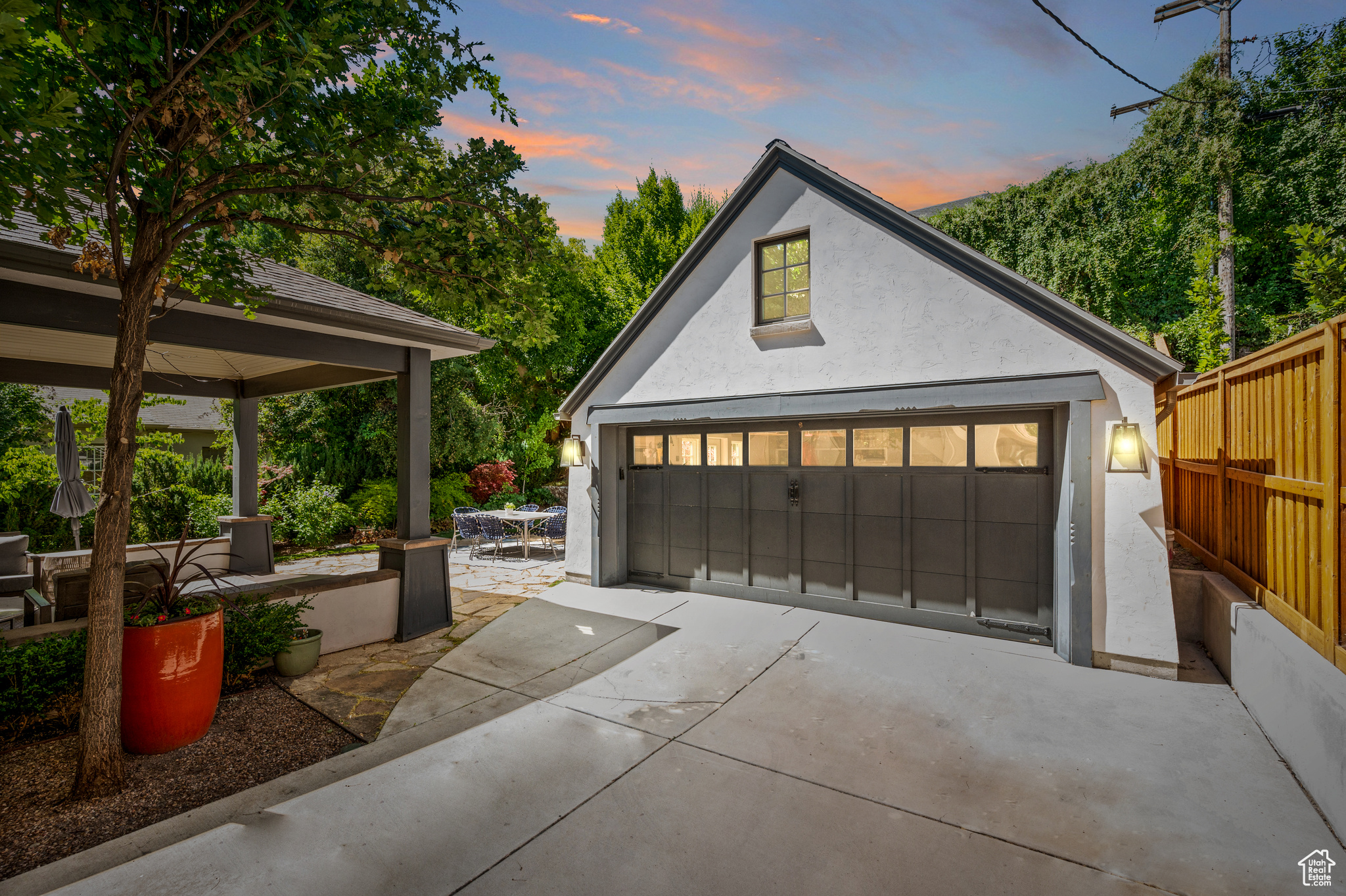 View of garage at dusk