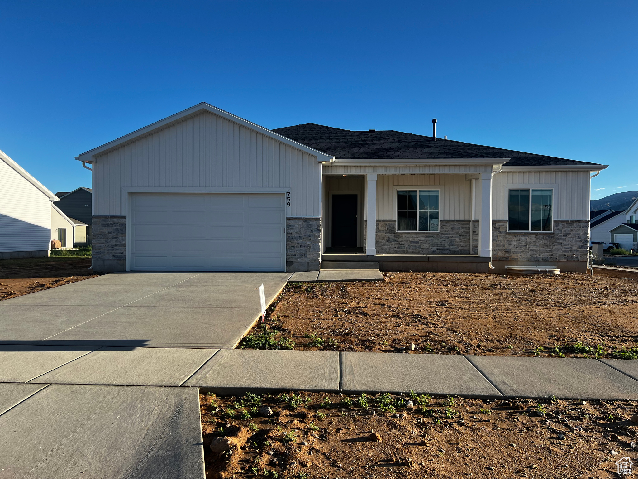 View of front facade featuring a garage