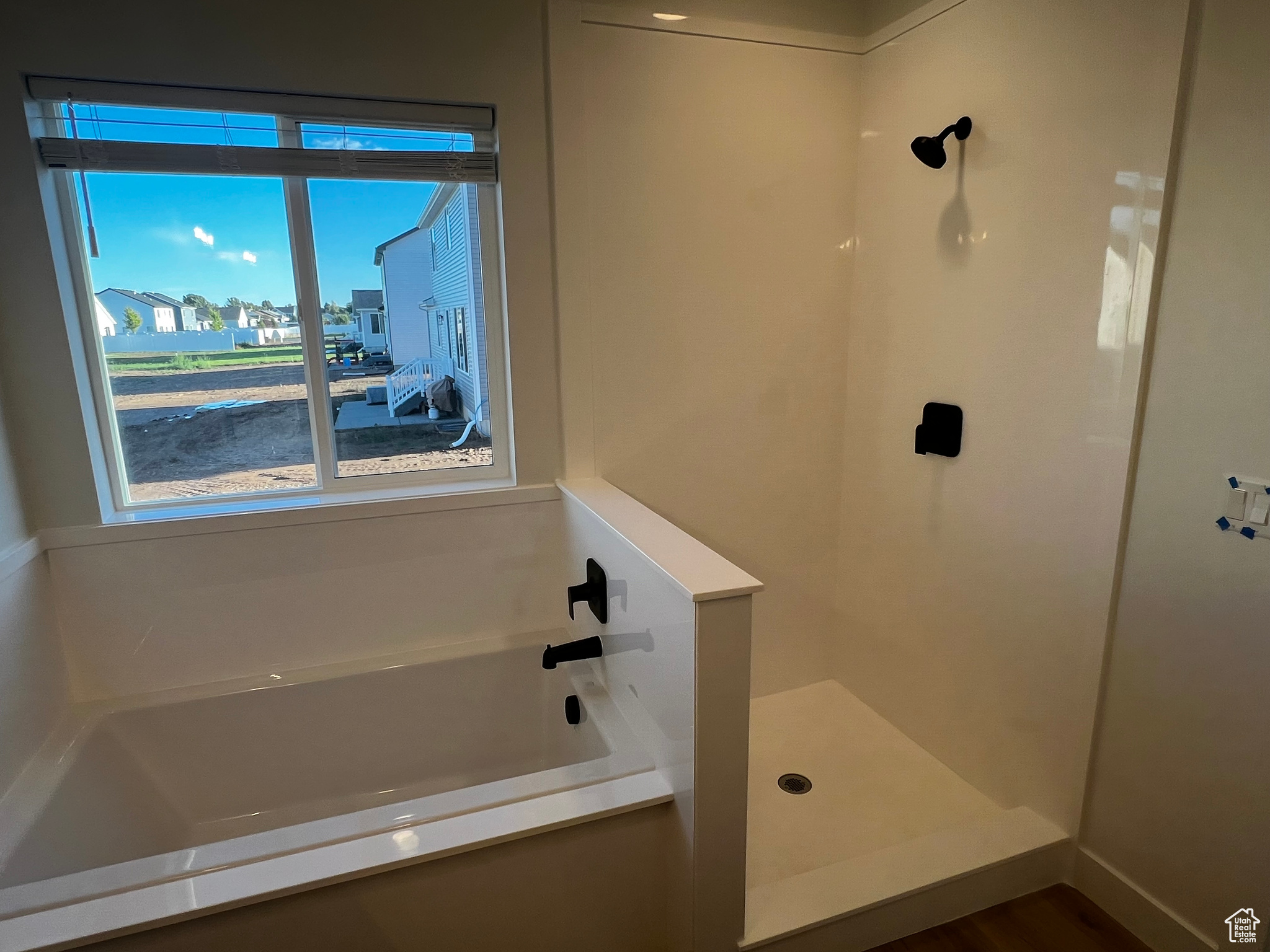 Bathroom featuring plus walk in shower