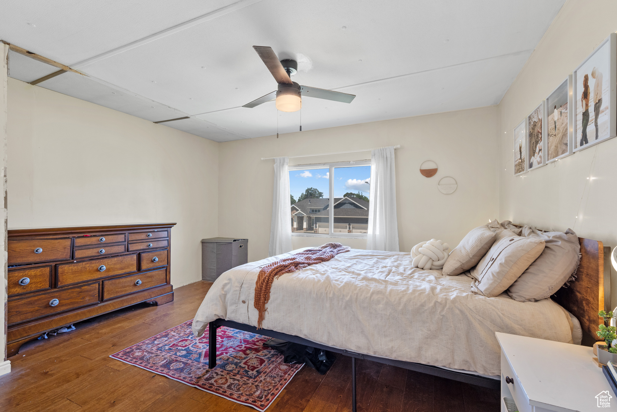 Bedroom with hardwood / wood-style flooring and ceiling fan