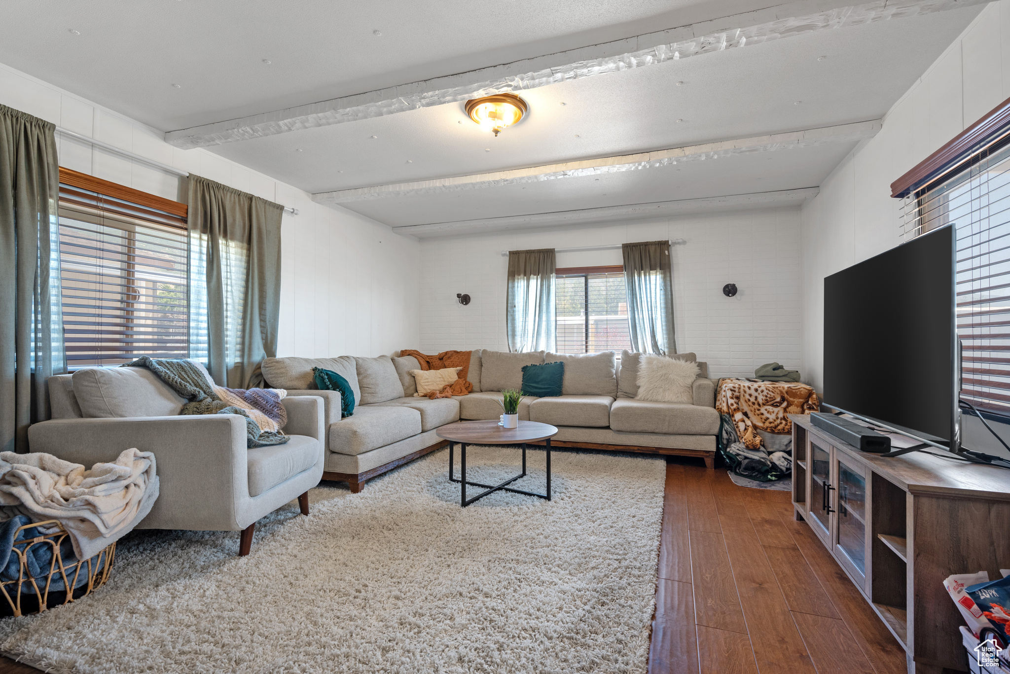 Living room featuring dark hardwood / wood-style flooring