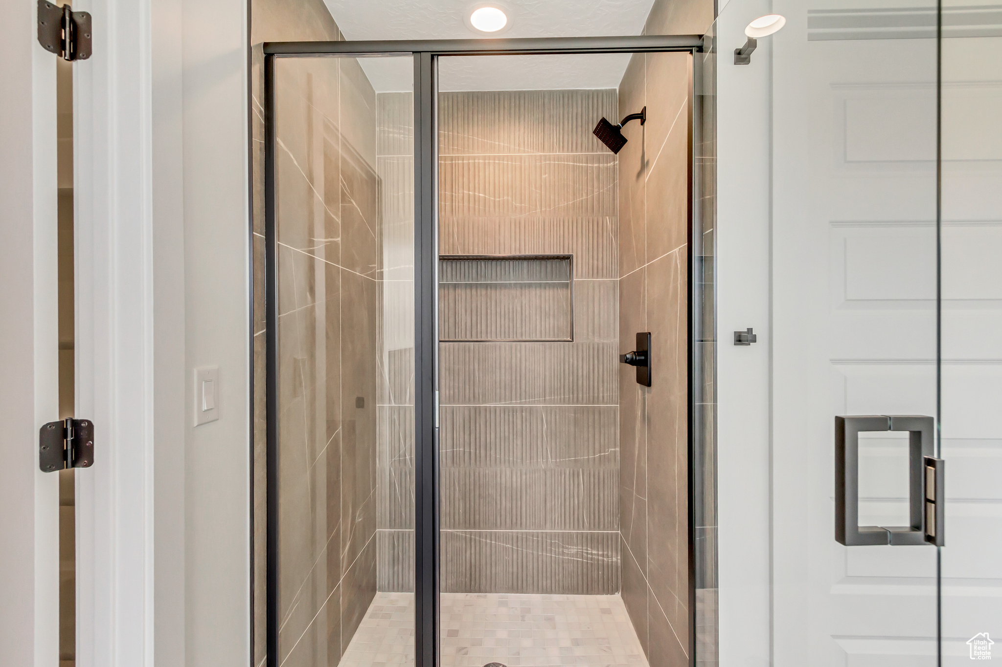 Bathroom featuring an enclosed shower